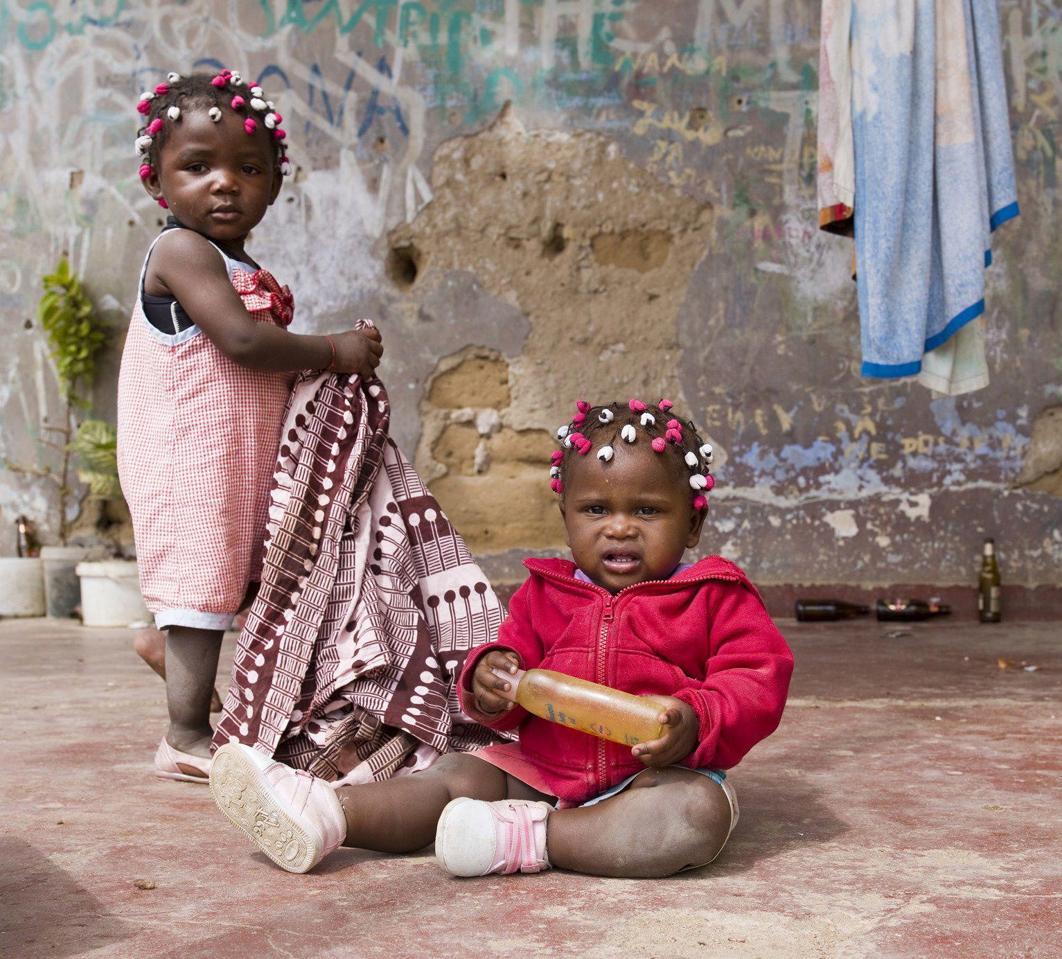 Kids in Namibe, Angola hanging clothes