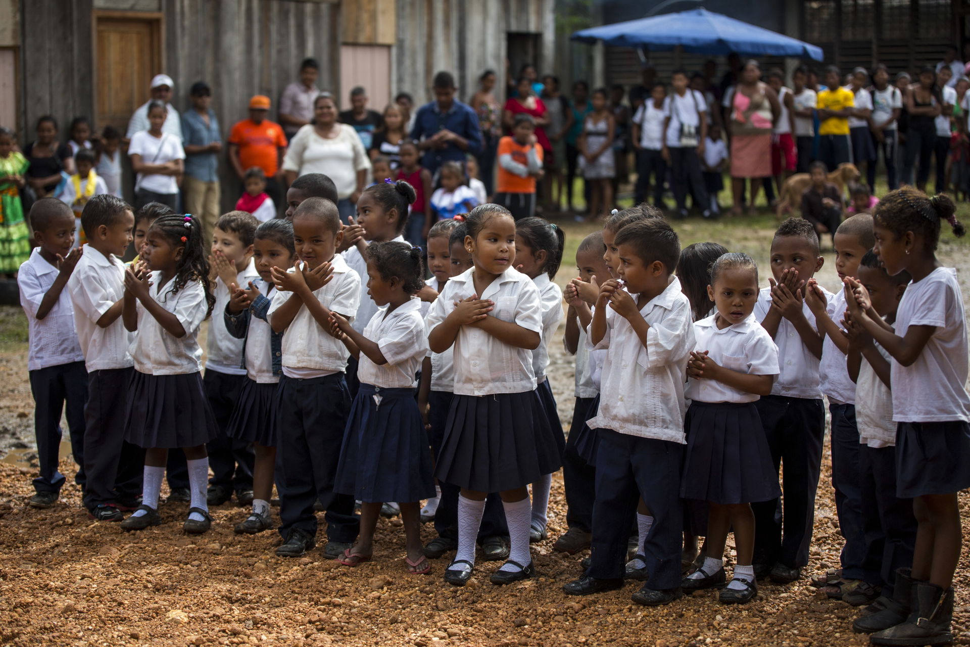 Children from Victor Hugo Echeverria primary school blow kisses…
