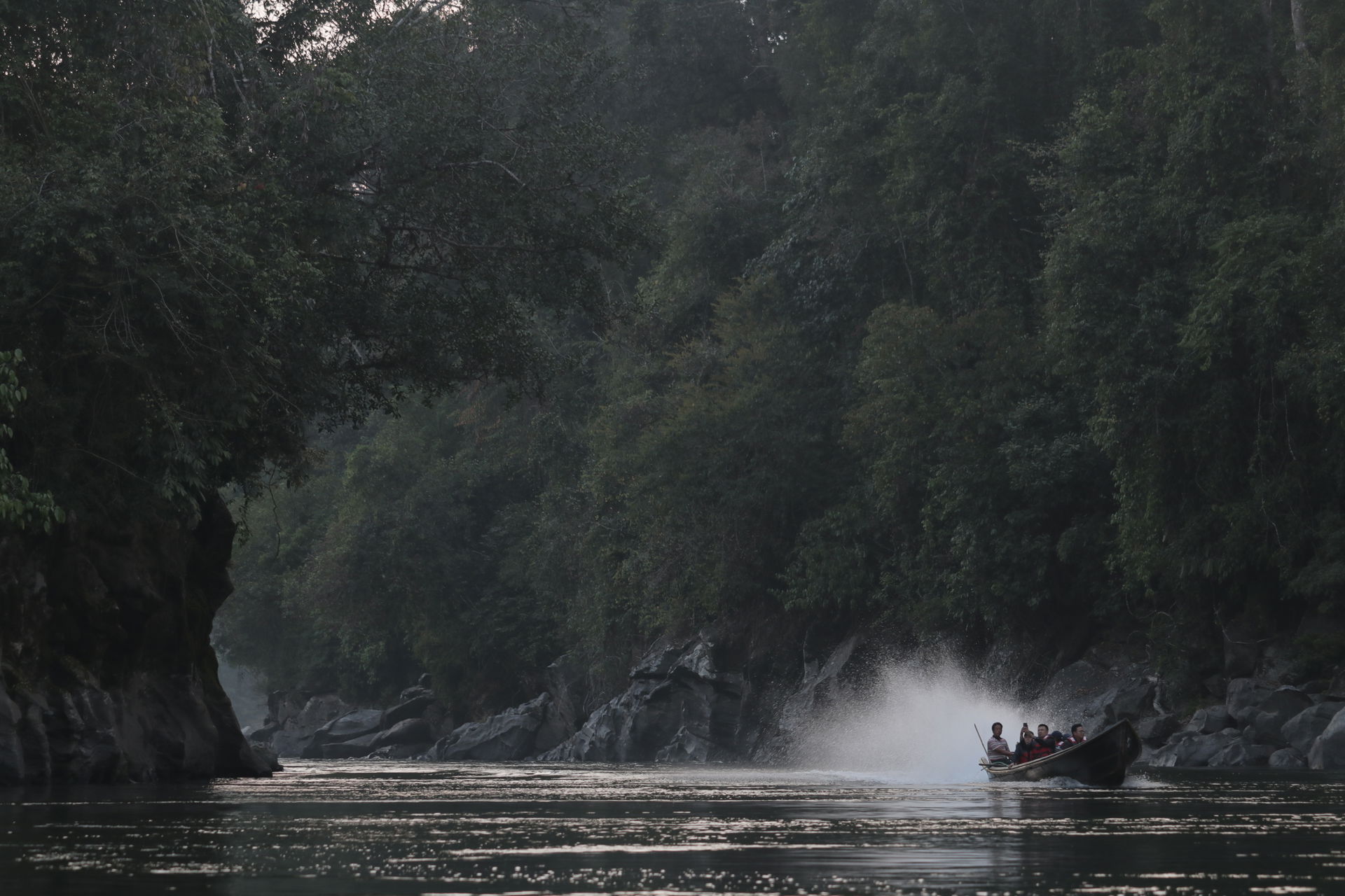 Tourists on boat enjoying pristine nature of Putao region