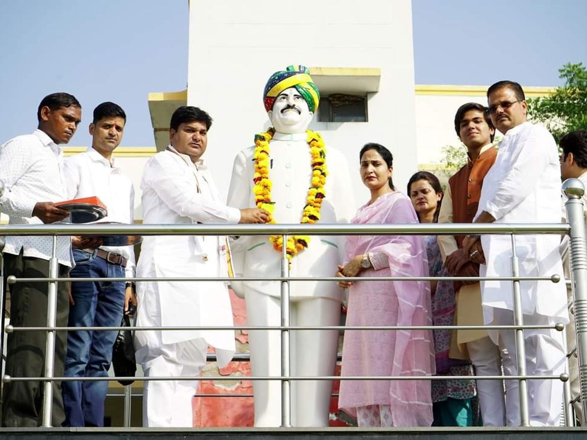 Dr. Digamber Singh’s family garlands his statue at Dr. Digamber…