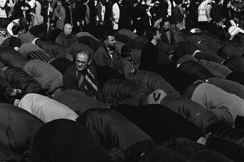 Photographed on Ilford HP5+, Shia worshippers pray during the 4…