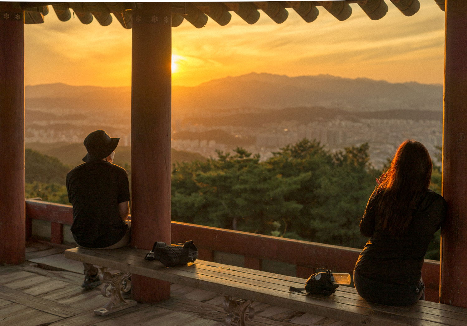 Two people viewing sunset from Bomunsan (mountain) Fortress in …