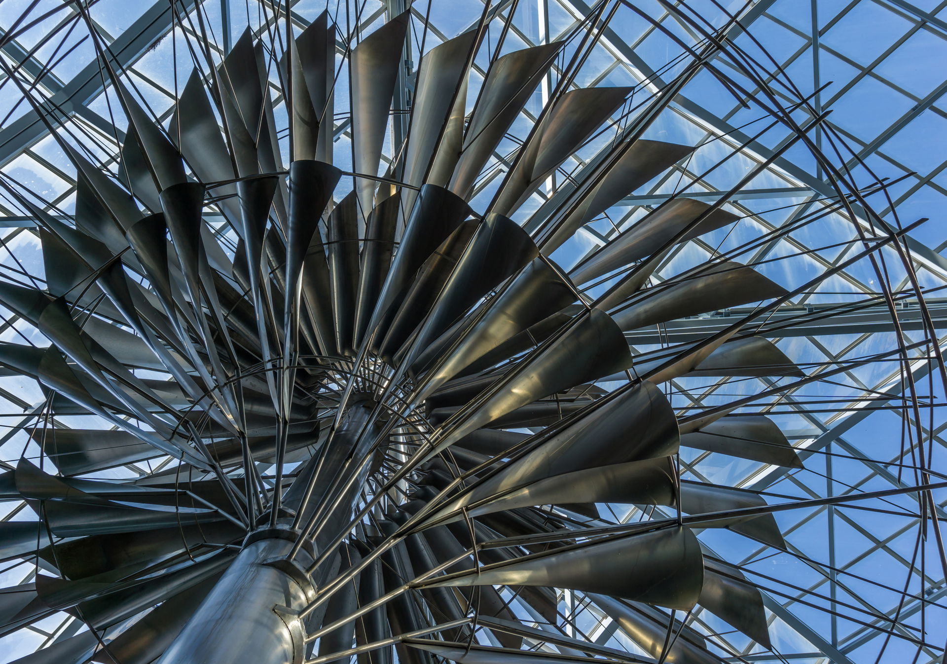 View from below of Dynamic Mobile Steel Sculpture, an abstract …