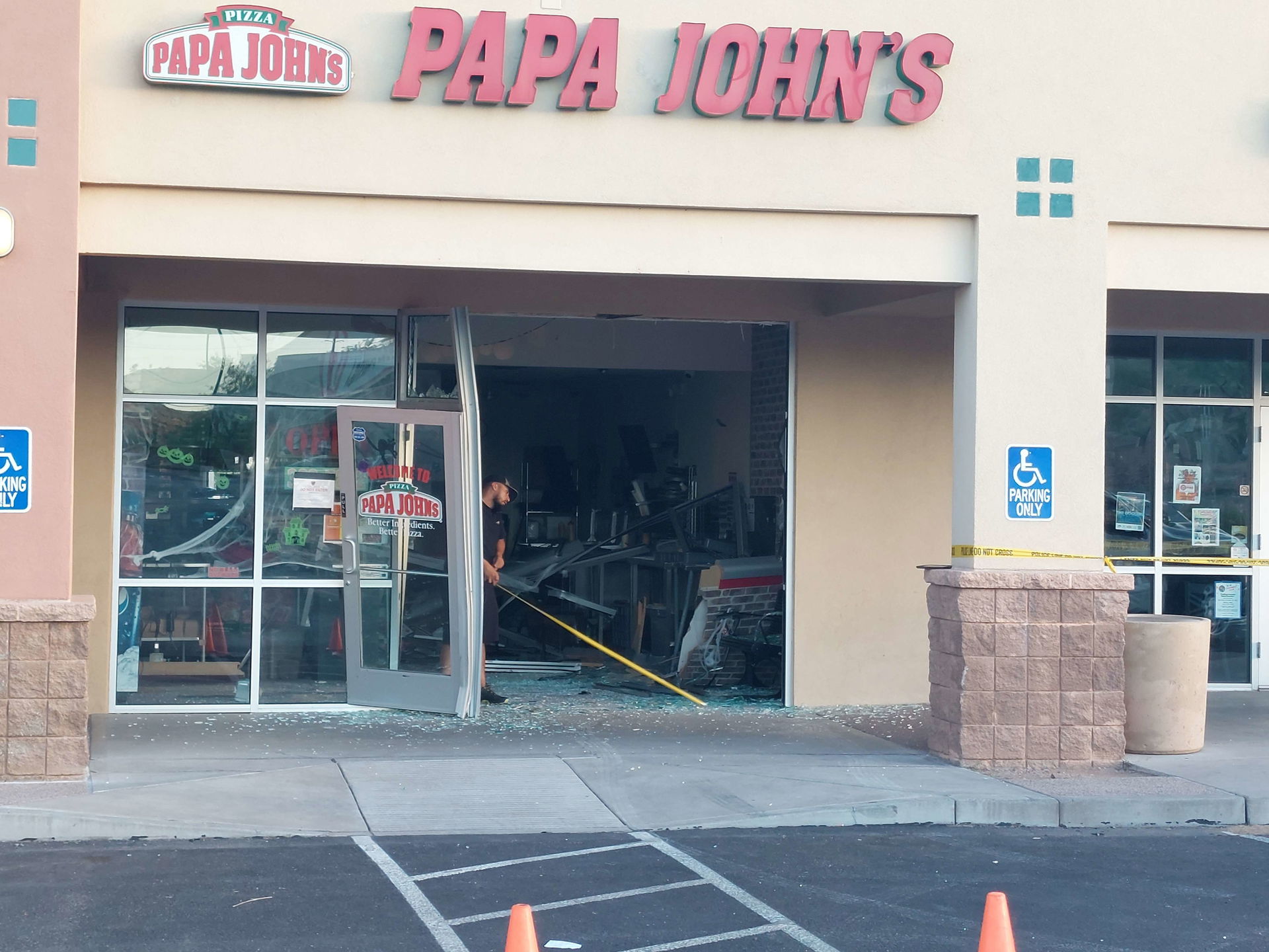 Photograph of the aftermath of a car (apparently accidentally) …