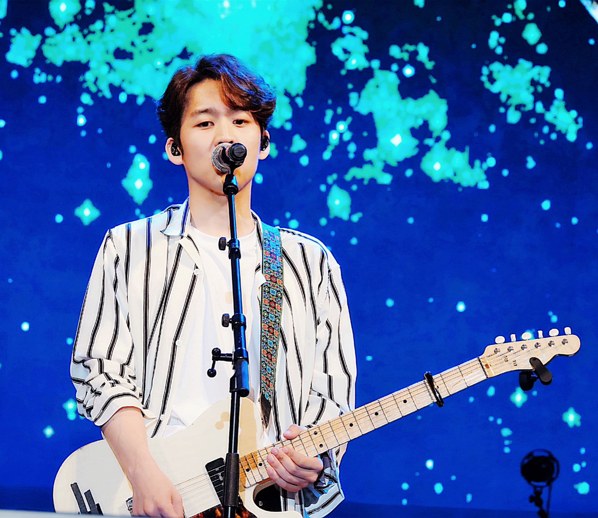 A Korean singer Ha Dong Qn performing at a festival in 2019