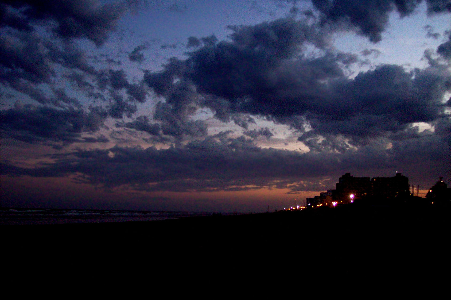 Sunset over the beach and city of Mar de Ajó, Buenos Aires, Arg…