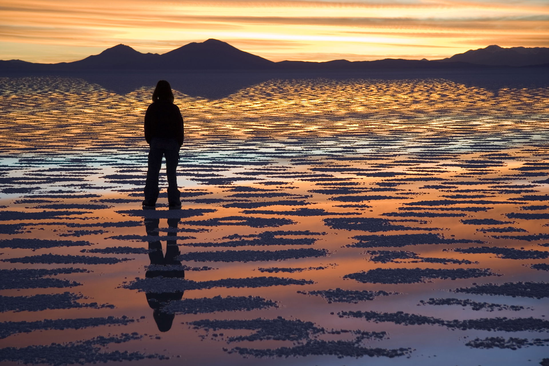 Watching Sunset, Salar de Uyuni, Bolivia. When is covered with …
