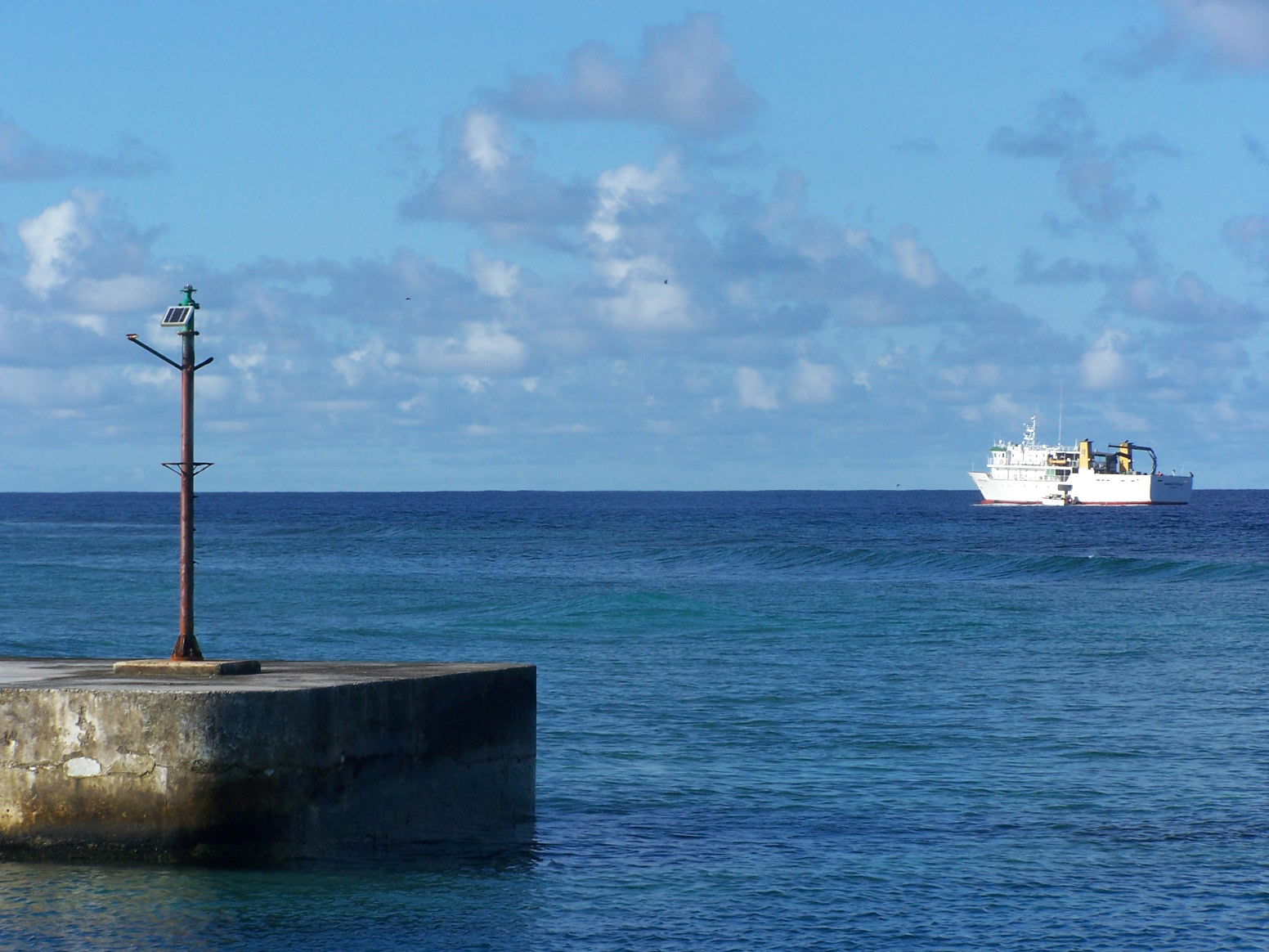 Photo taken from the harbour breakwater on Vaitupu Island. The …