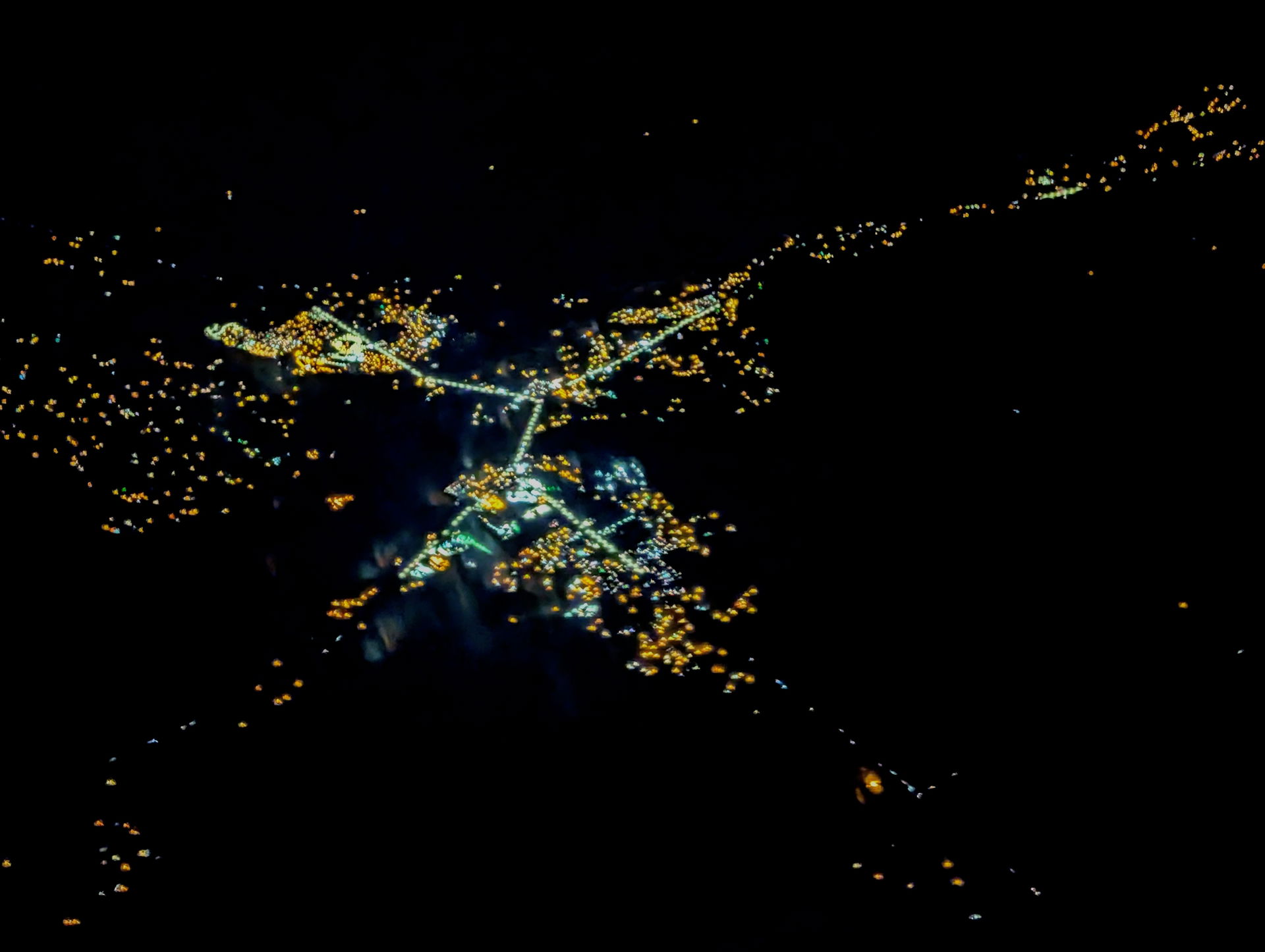 Night aerial view of Shiprock, New Mexico, where US route 64 an…