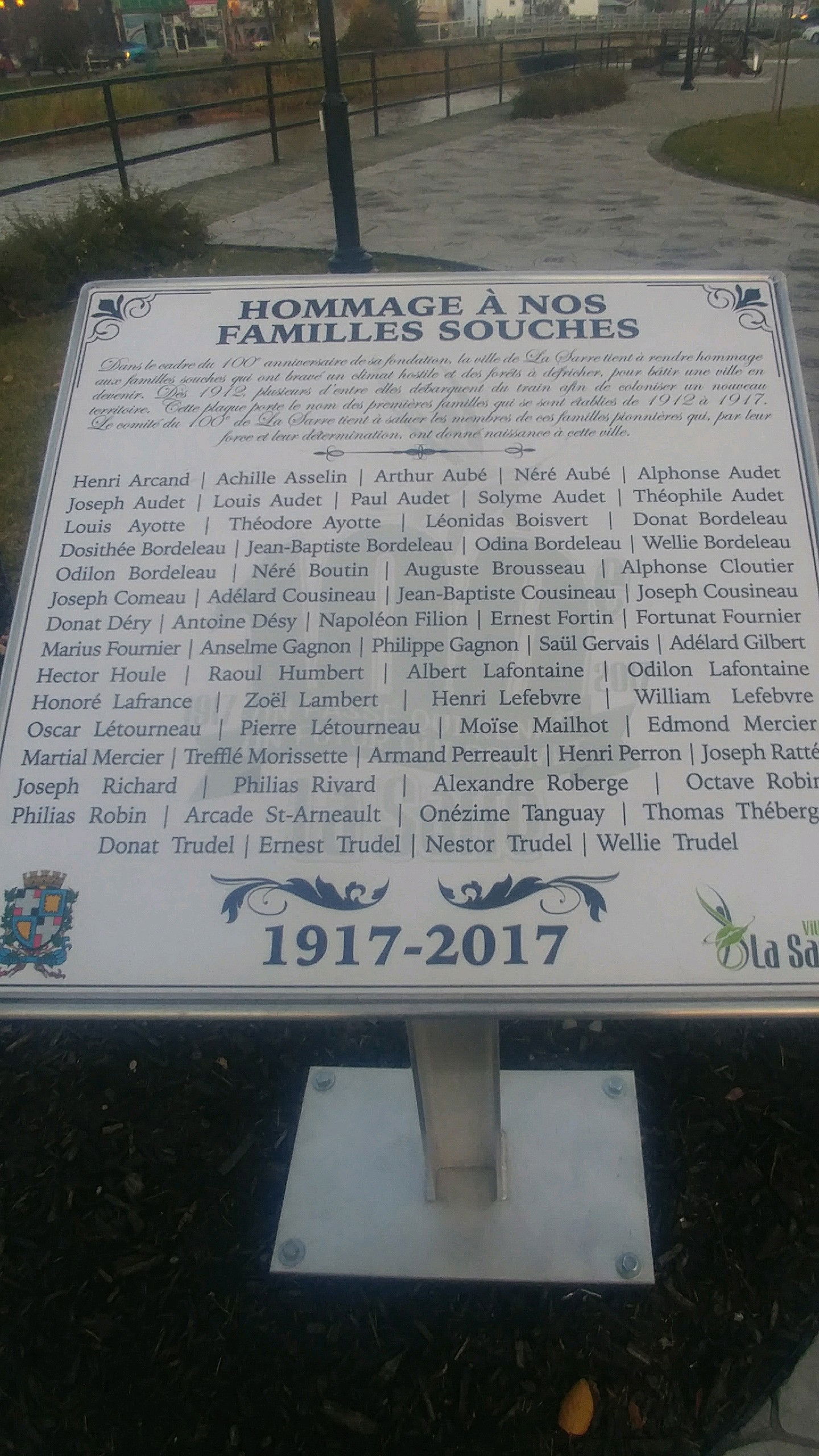 La Sarre tribute family tribute sign displayed in a park in dow…