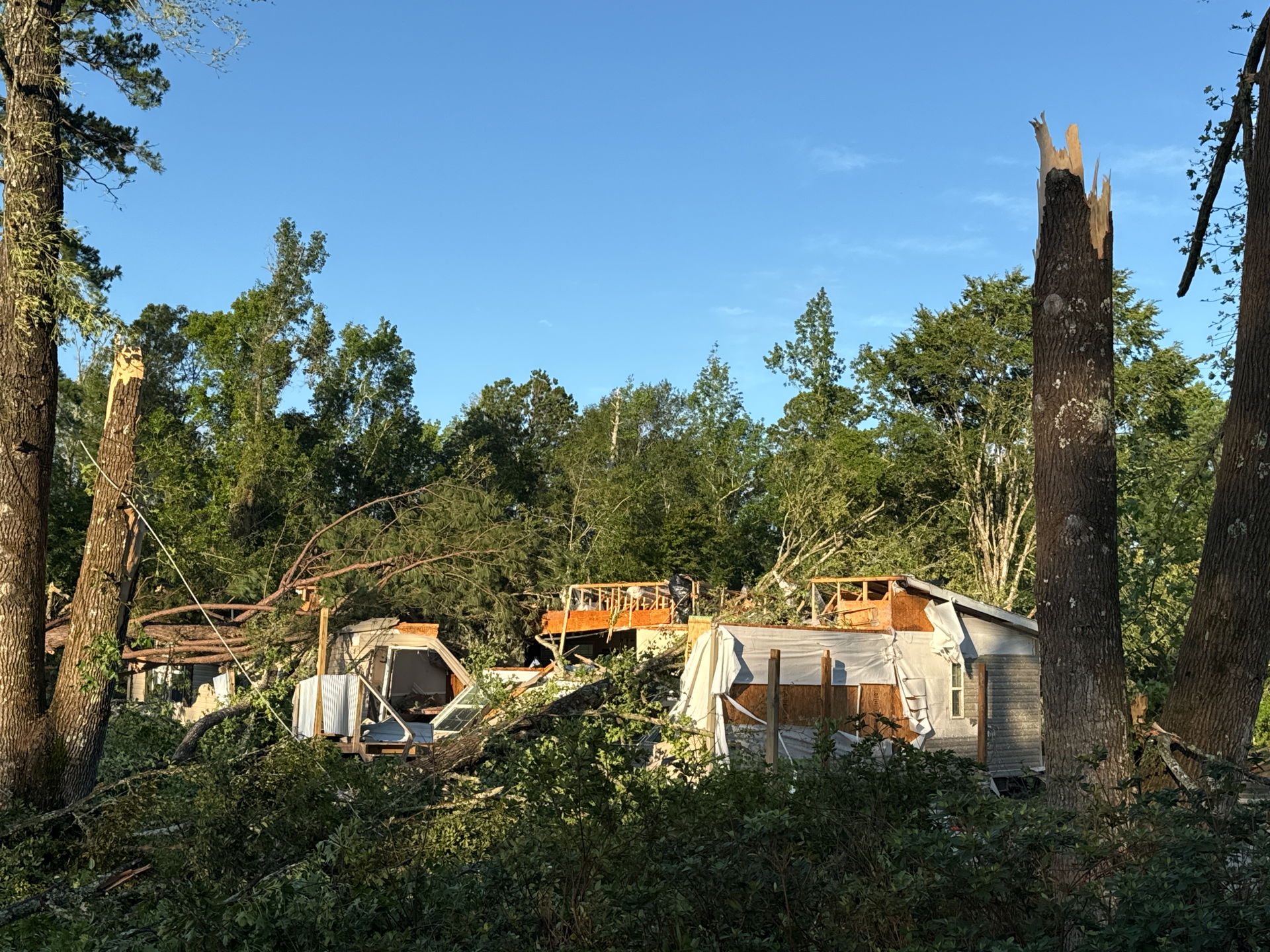 EF2 damage to trees and a destroyed mobile home on the southwes…