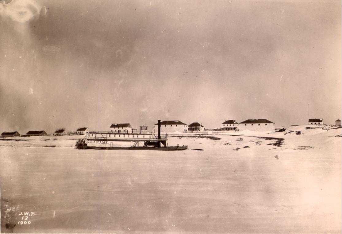 Fort Chipewyan in 1900 by Tyrrell with steamer Grahame frozen i…