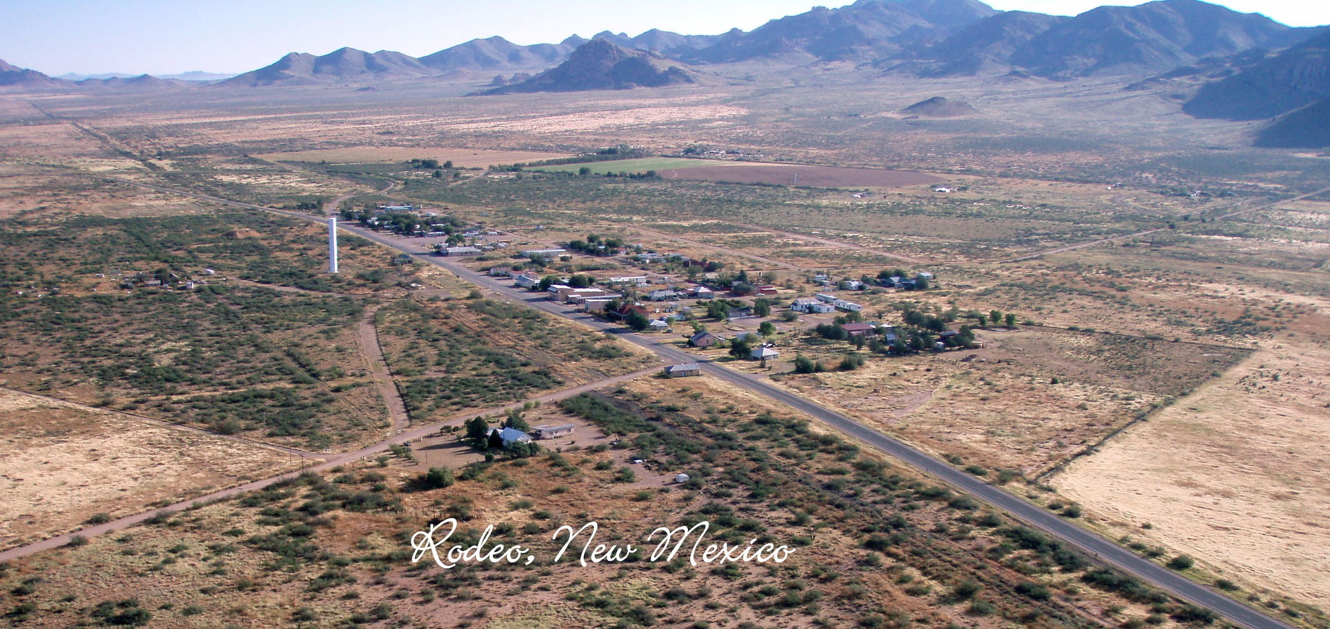 A low level aerial view of Rodeo, New Mexico from the southwest…