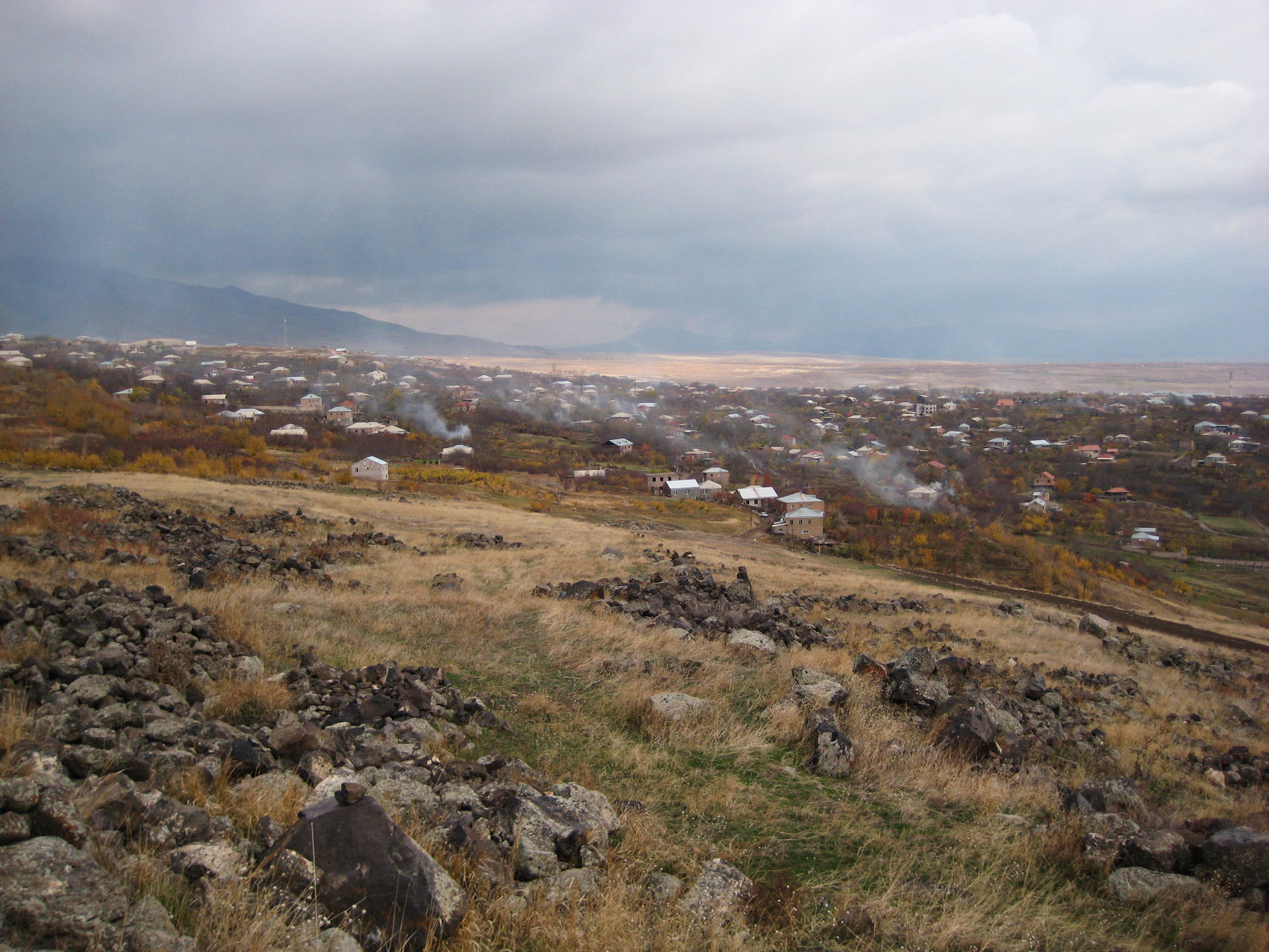 The village of Ushi. The smoke is from people burning dead plan…
