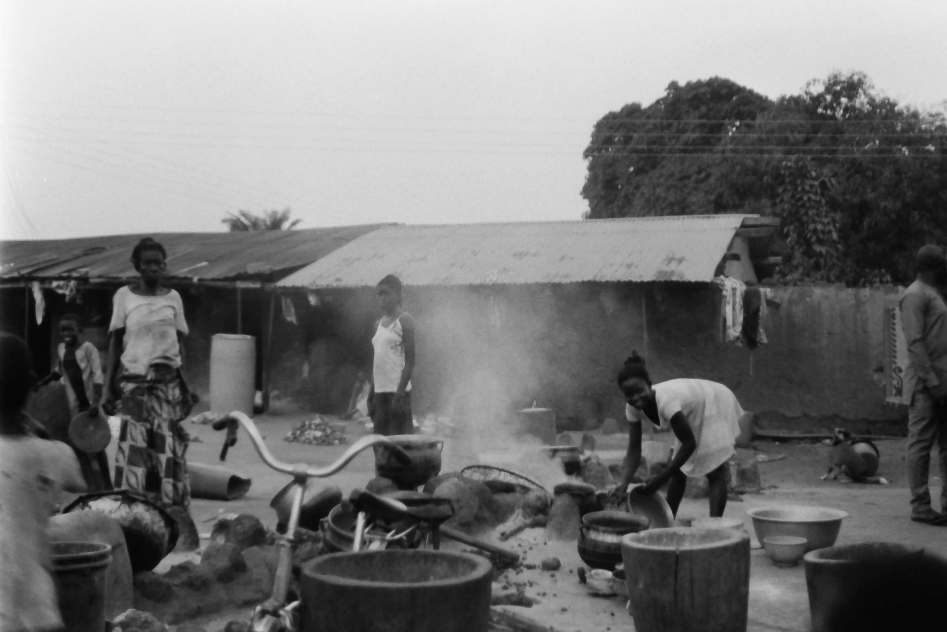 This black-and-white photograph captures a lively outdoor scene…