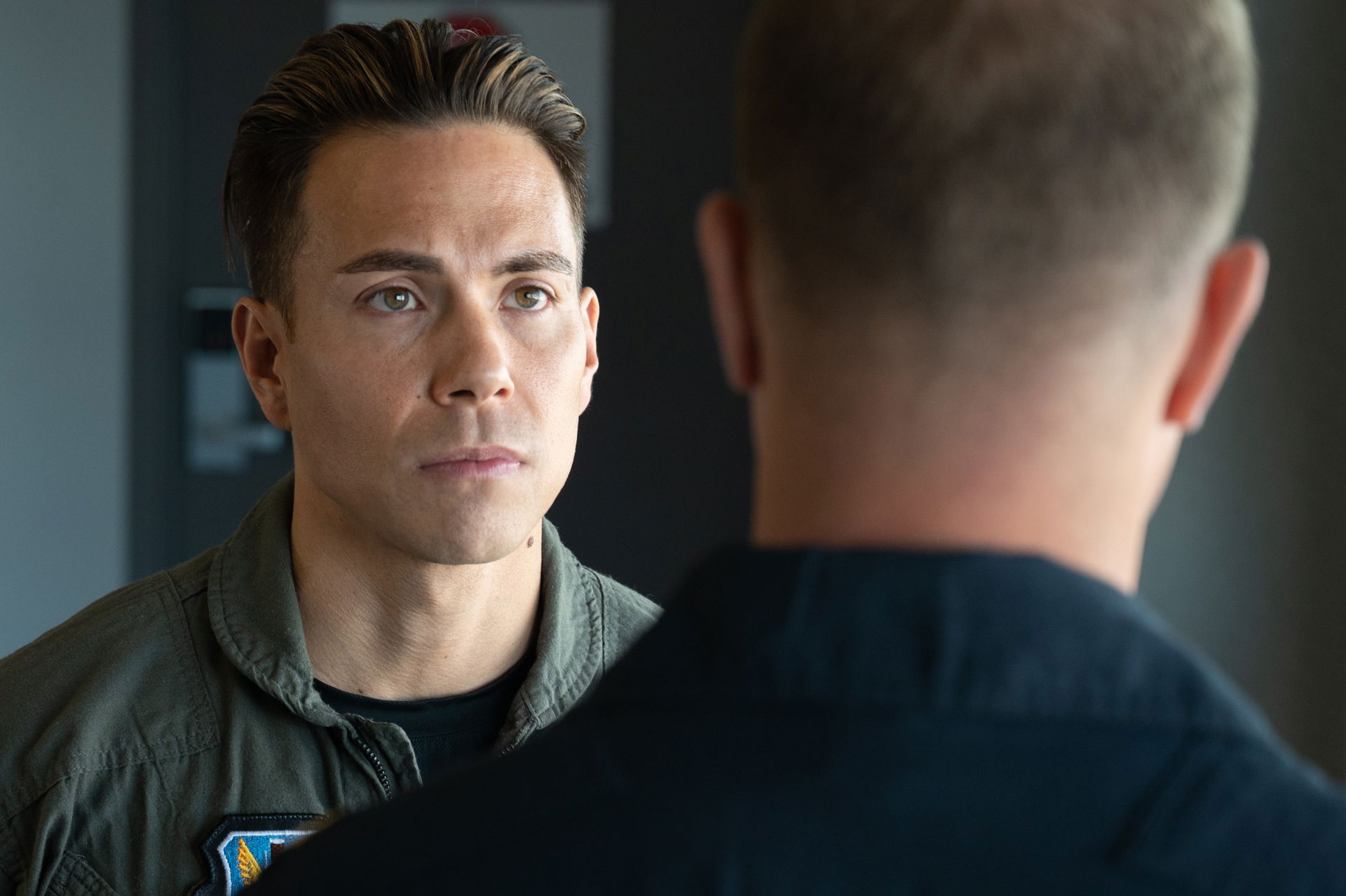 Eight-time Olympic medalist Apolo Ohno listens to a pre-flight …
