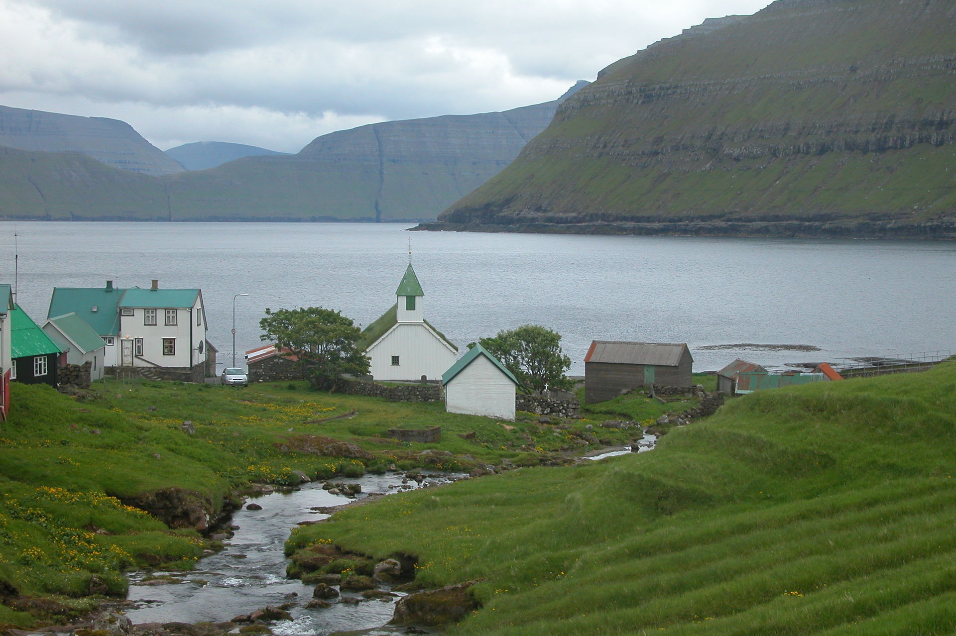 Oyndarfjørður, Eysturoy, Faroe Islands. In the background: Kals…
