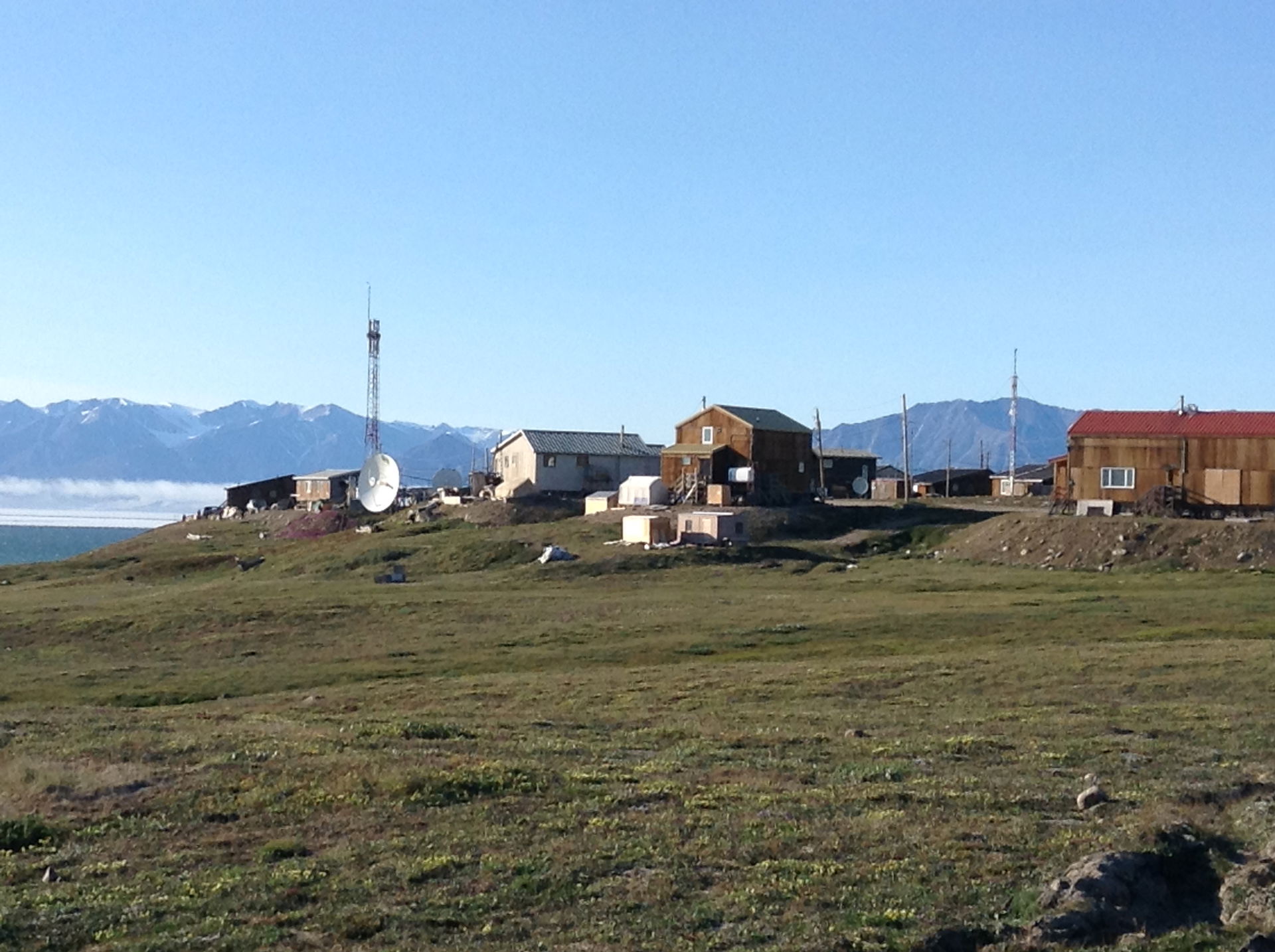 Pond Inlet, Nunavut in July 2022 seen from the west with Bylot …