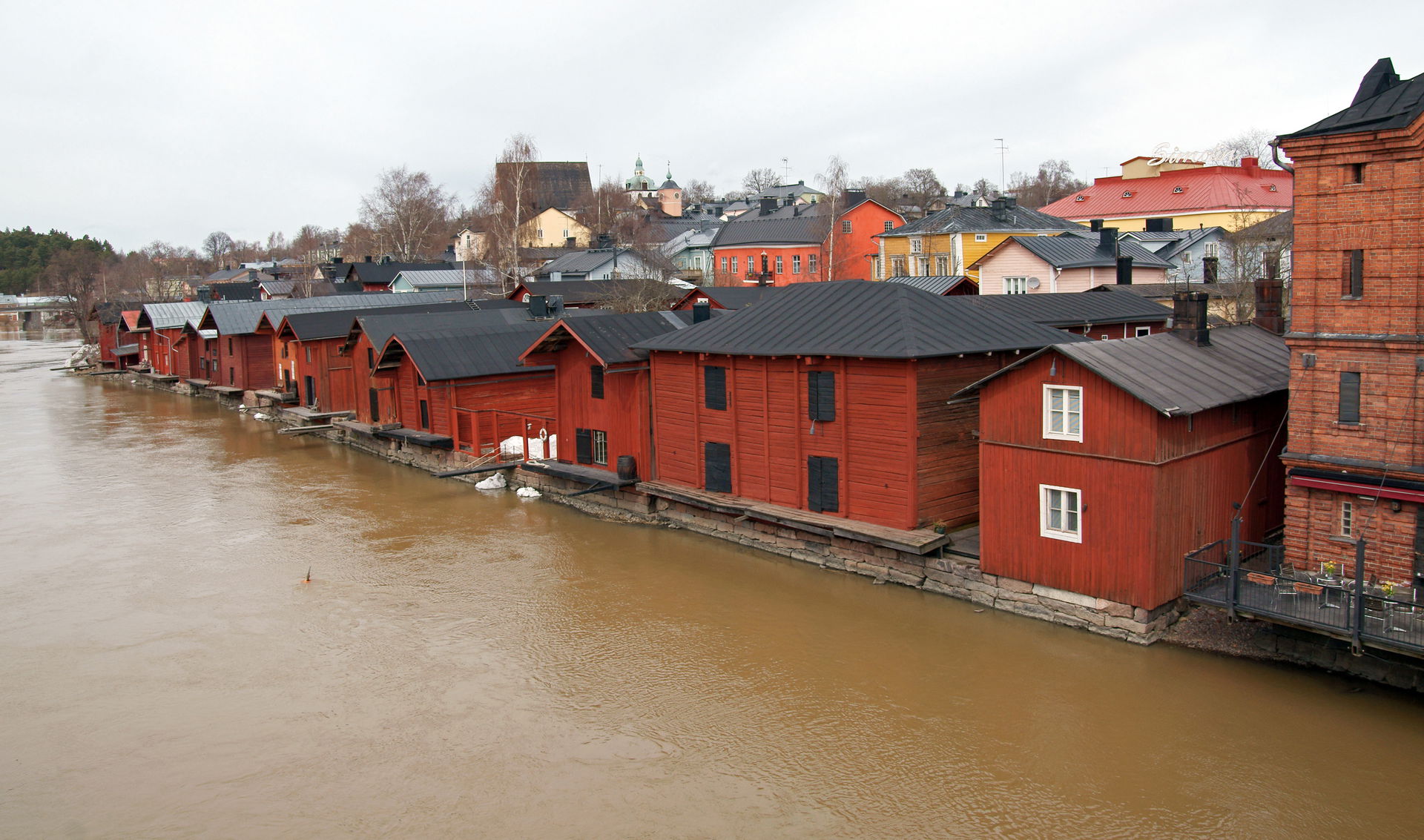 Old Porvoo riverside, featuring wooden storage buildings.