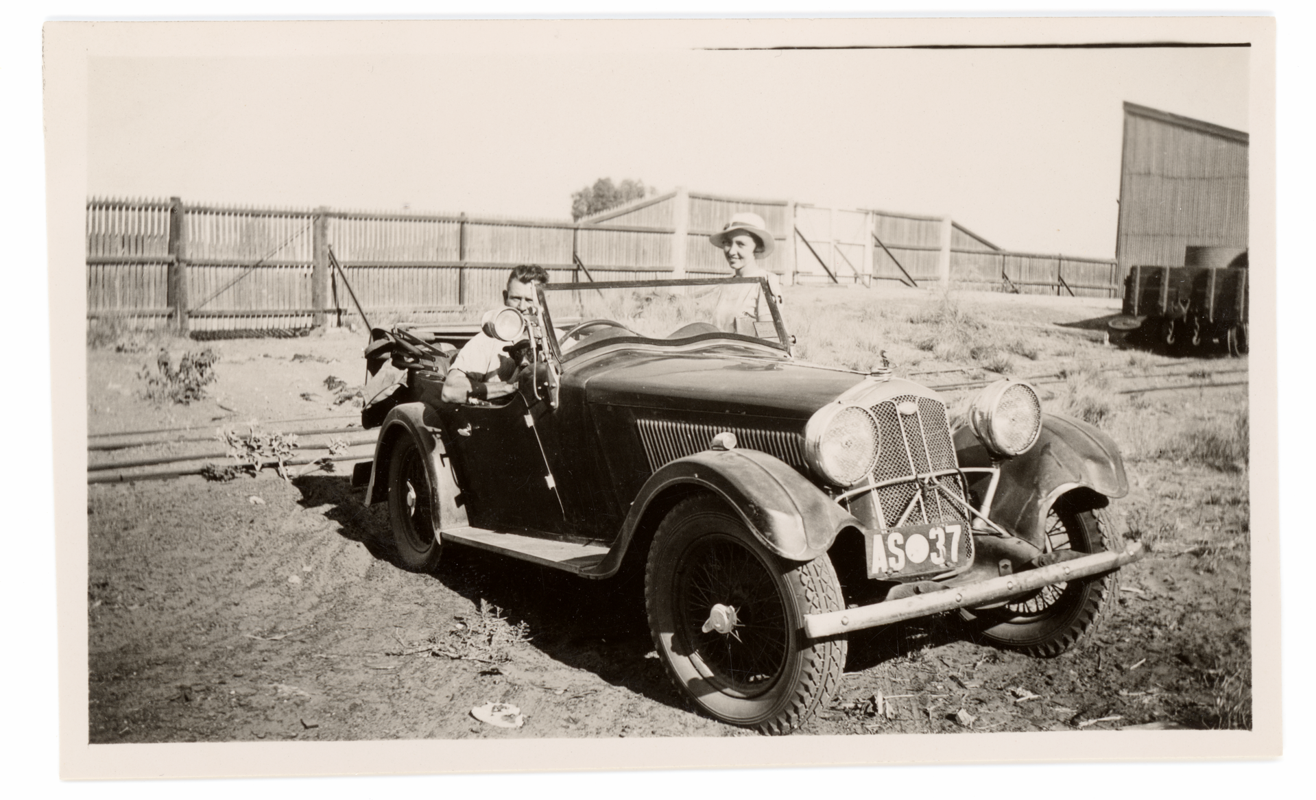 Two people and a car in Onslow, Western Australia, in 1938.
