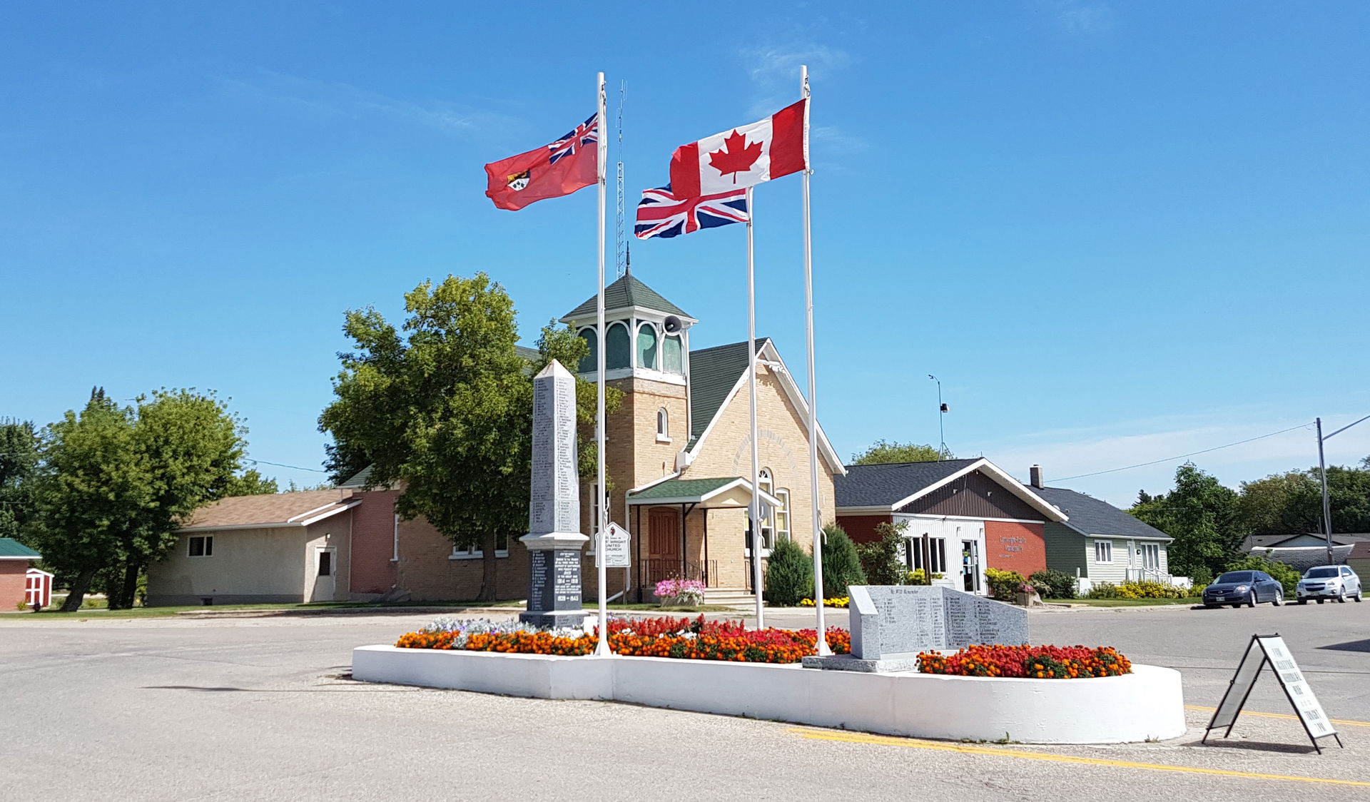 A view of Cartwright Manitoba, with the war cenotaph and flags …