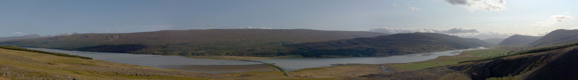 A panorama of the river Lagarfljót and, on its opposite bank, t…