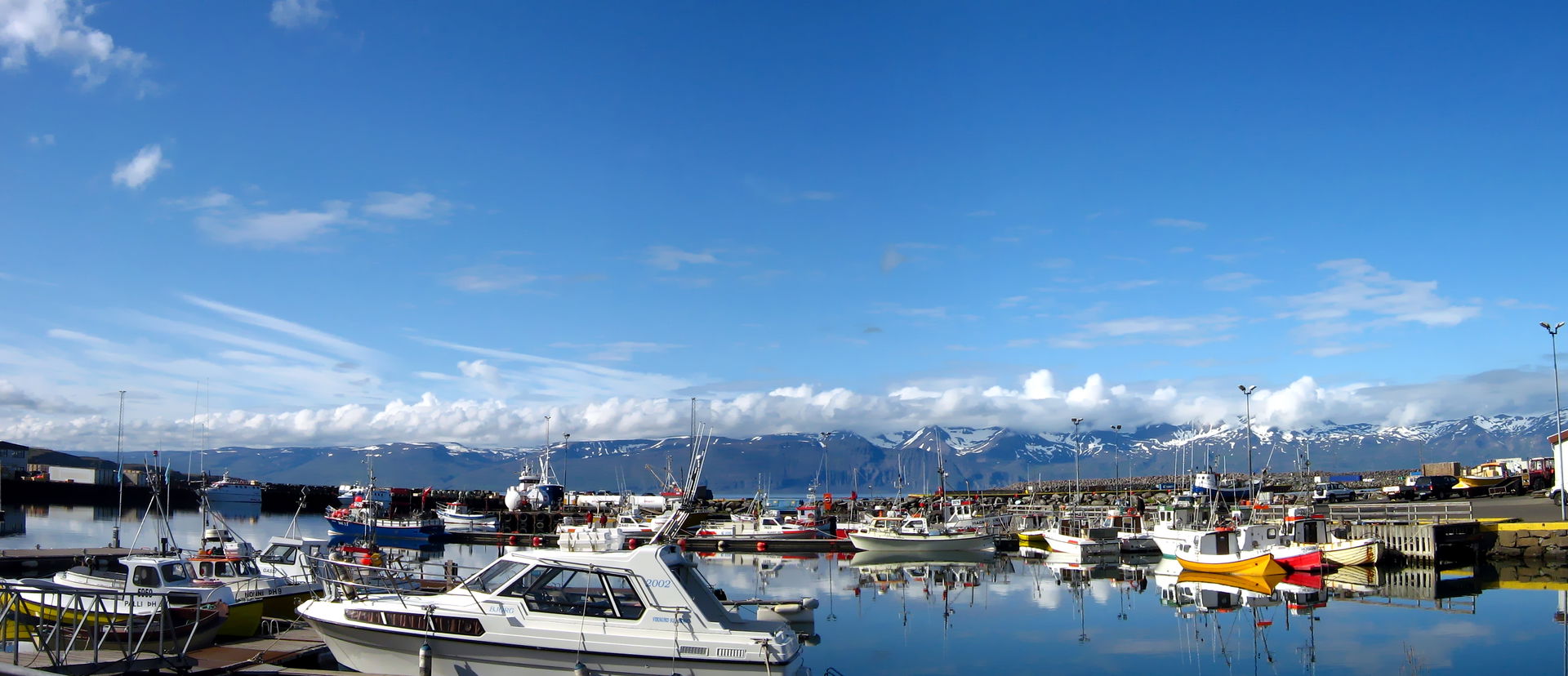Húsavík harbour, from where the whale watching tours depart, Ic…
