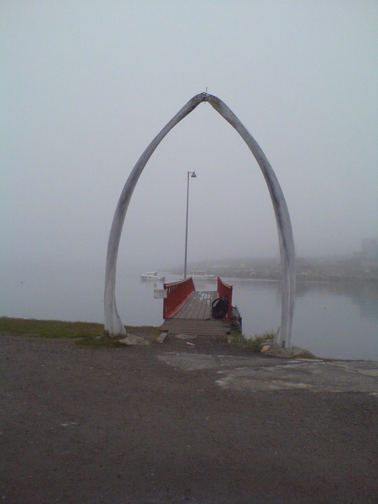 The access to the ferry landing stage in Qeqertarsuaq is framed…