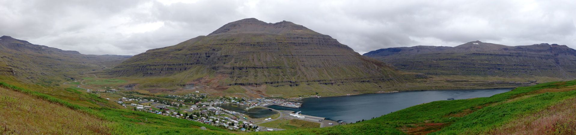A panorama of the town of Seyðisfjörður and the fjord of the sa…