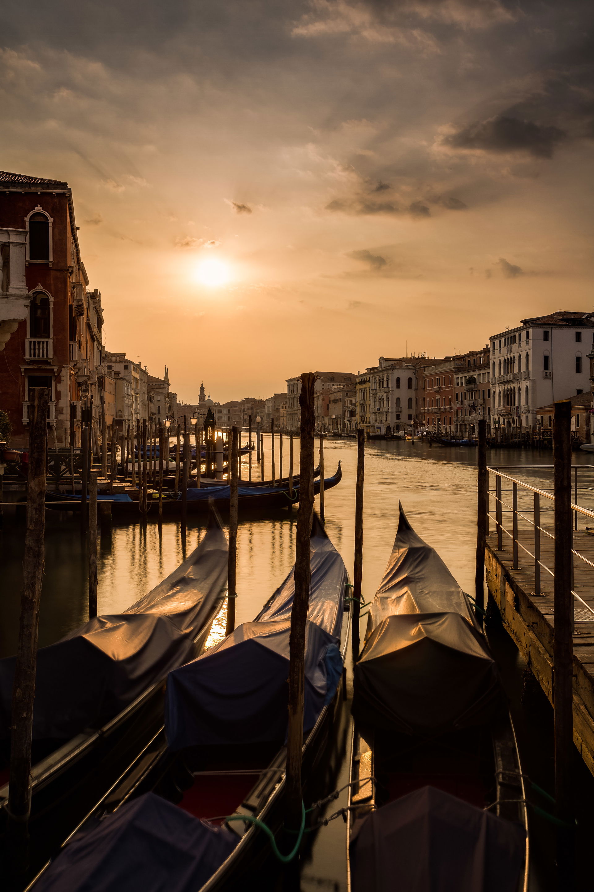 Sunrise over Gondolas parked in the Grand Canal, Venice, Italy