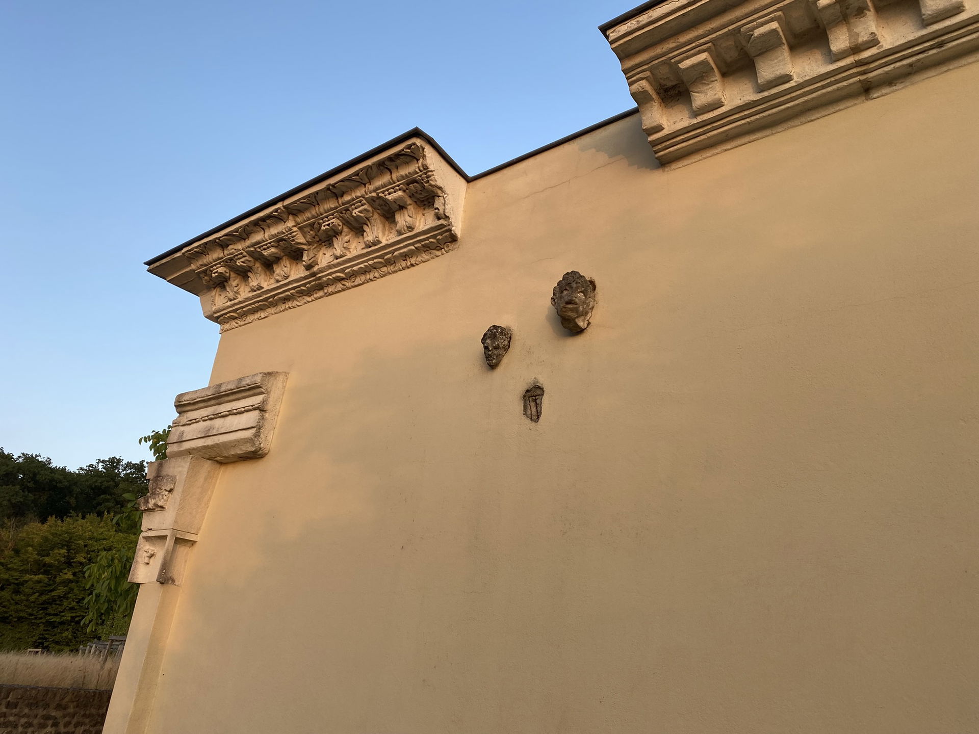 Unearthed Roman artifacts mounted on a reconstructed wall, Pota…