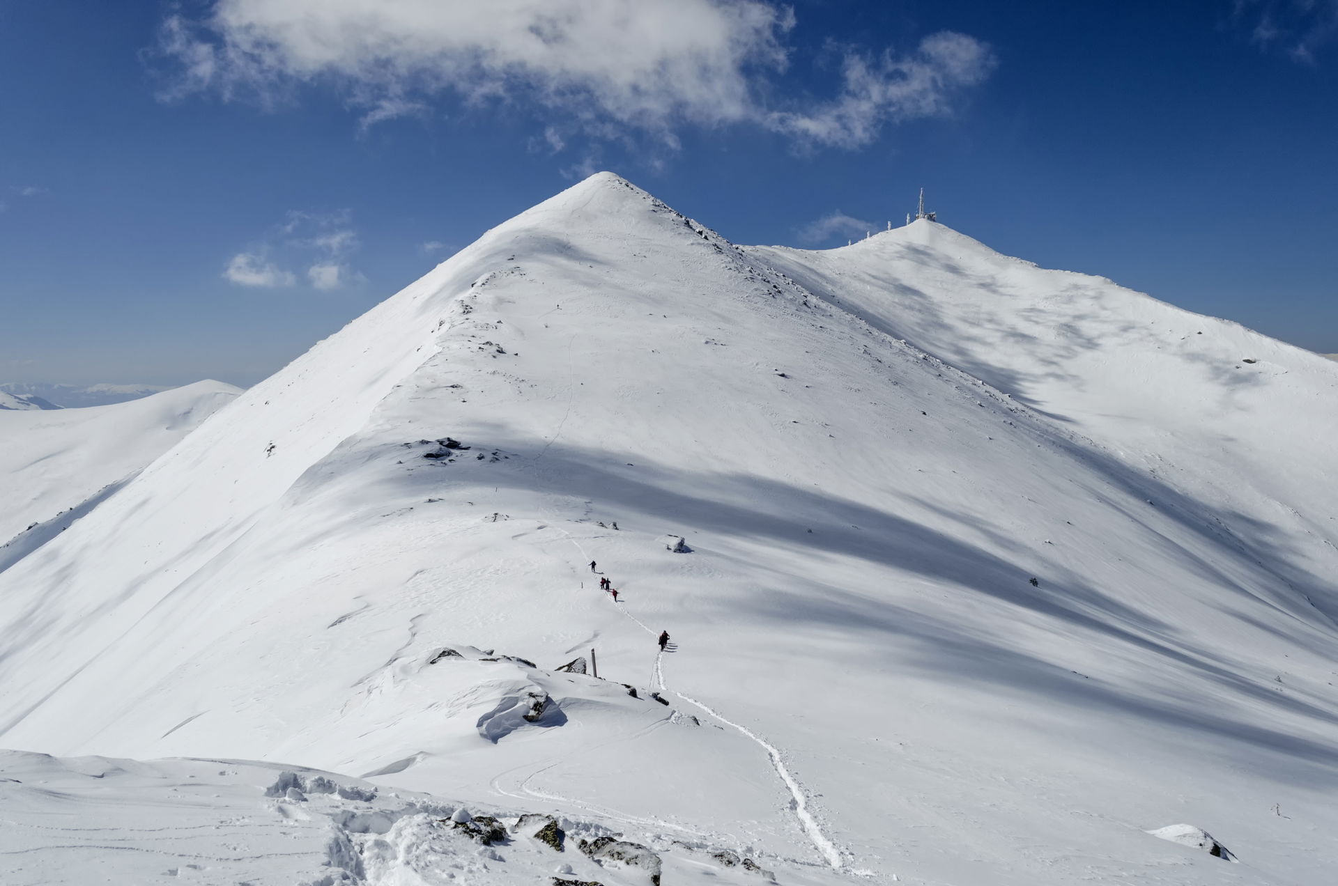 Peaks Ilinden (2,542 metres (8,340 ft)) in the foreground and P…