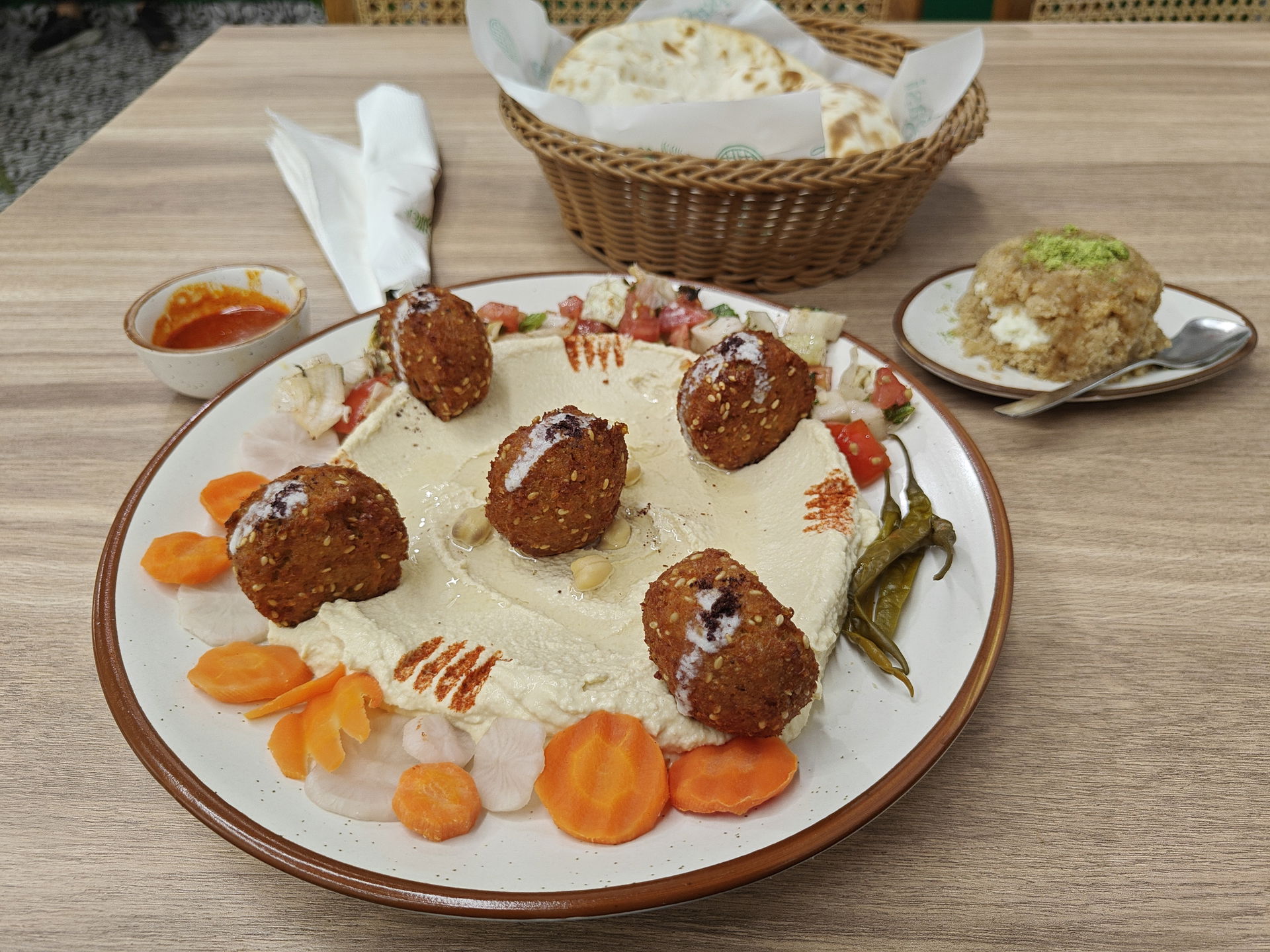 Hummus, falafel, pita bread, and mafrouka at Agasi, Lajpat Naga…