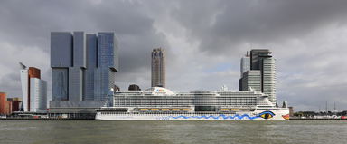 AIDAperla at Wilhelminapier in Rotterdam with the high-rises De…