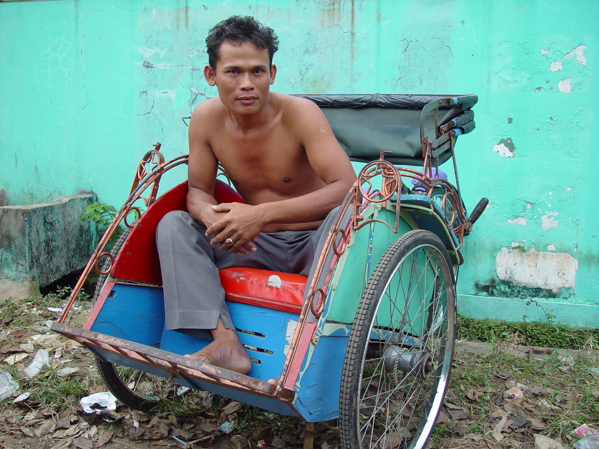 Becak driver, just outside of the city of Jakarta Indonesia.