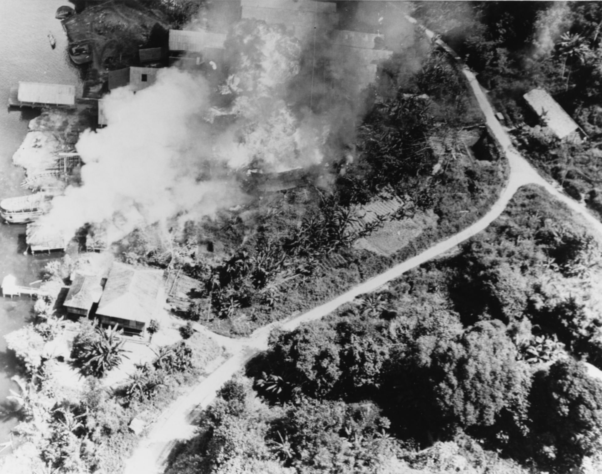 A coastal facility at Japanese-held Brunei burns vigorously aft…