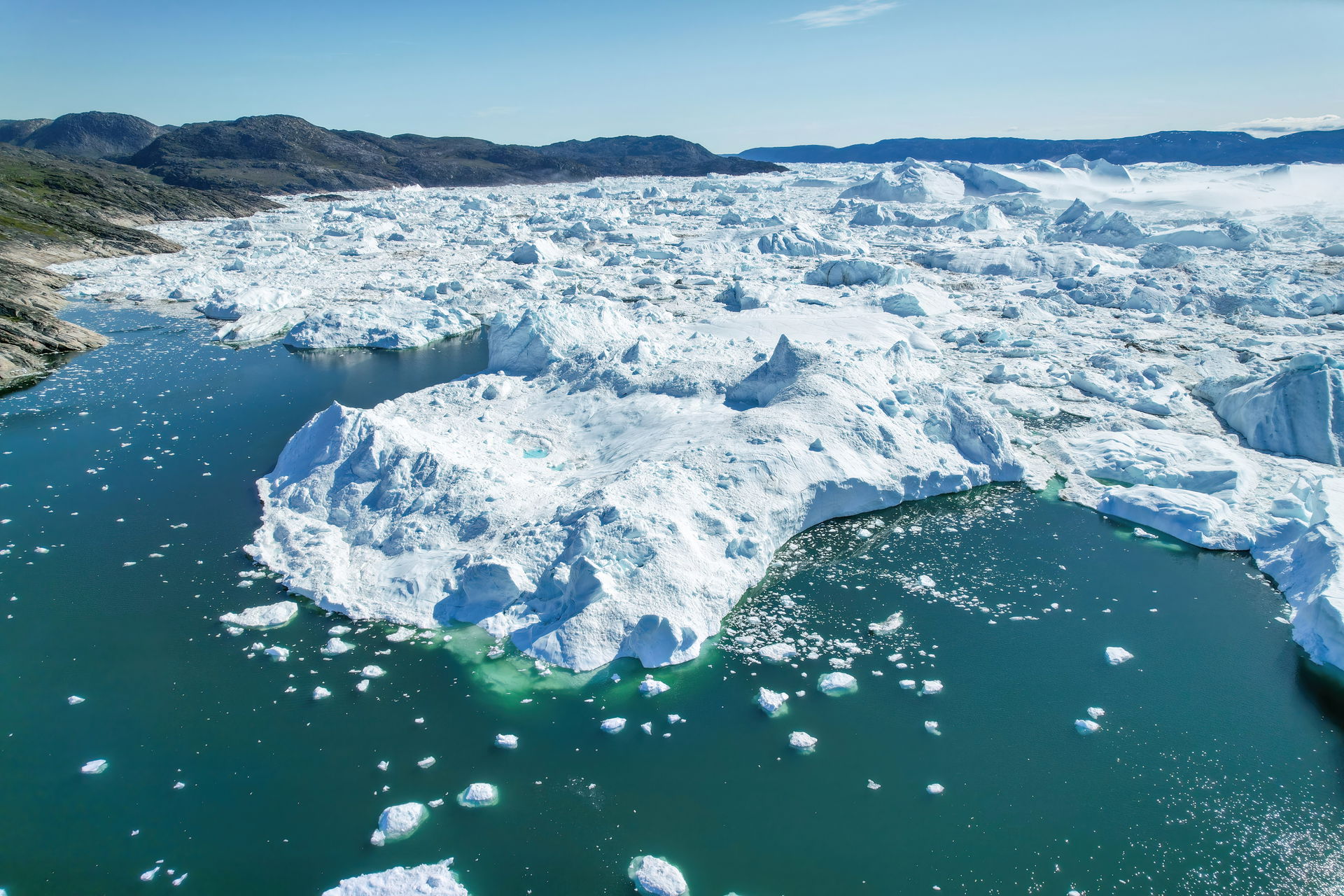 Aerial view of Jakobshavn Glacier at Disko Bay, Greenland. The …