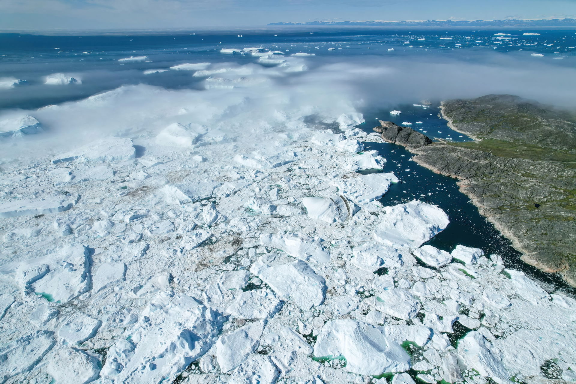 Aerial view of Jakobshavn Glacier at Disko Bay, Greenland. The …