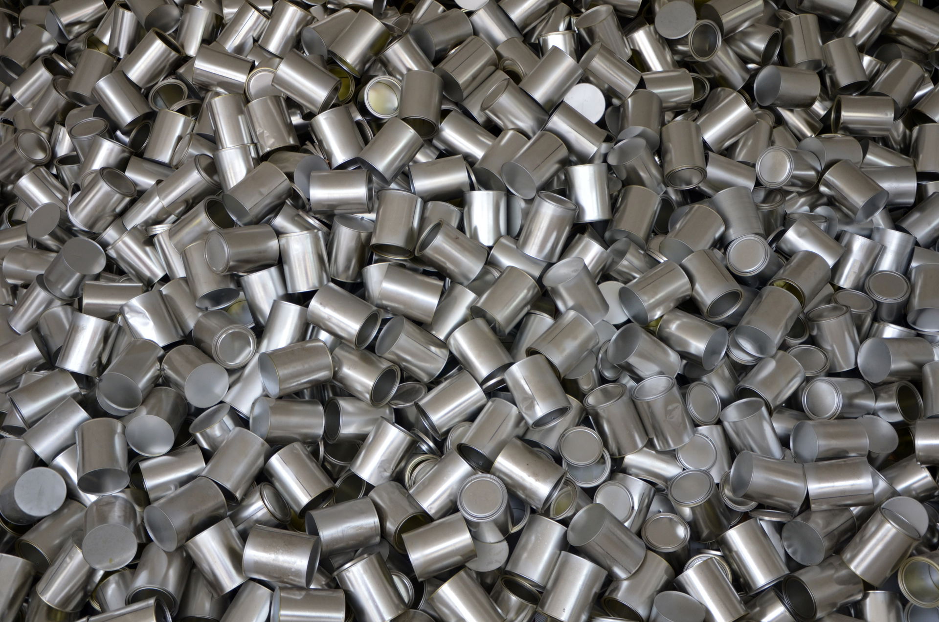Heap of cans, symbolizing unrestrained consumption, outside the…