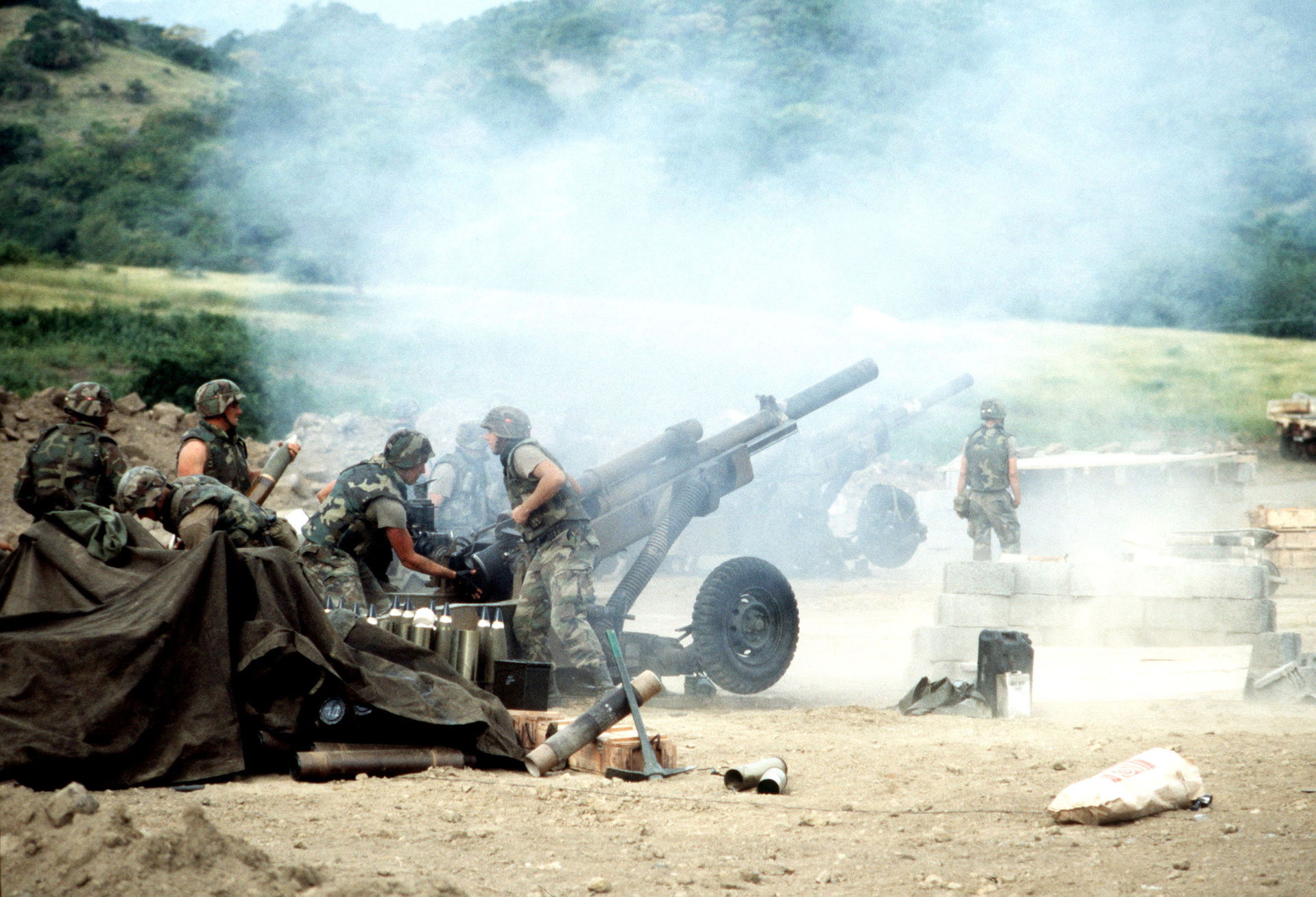 82nd Airborne artillery personnel load and fire M102 105 mm how…