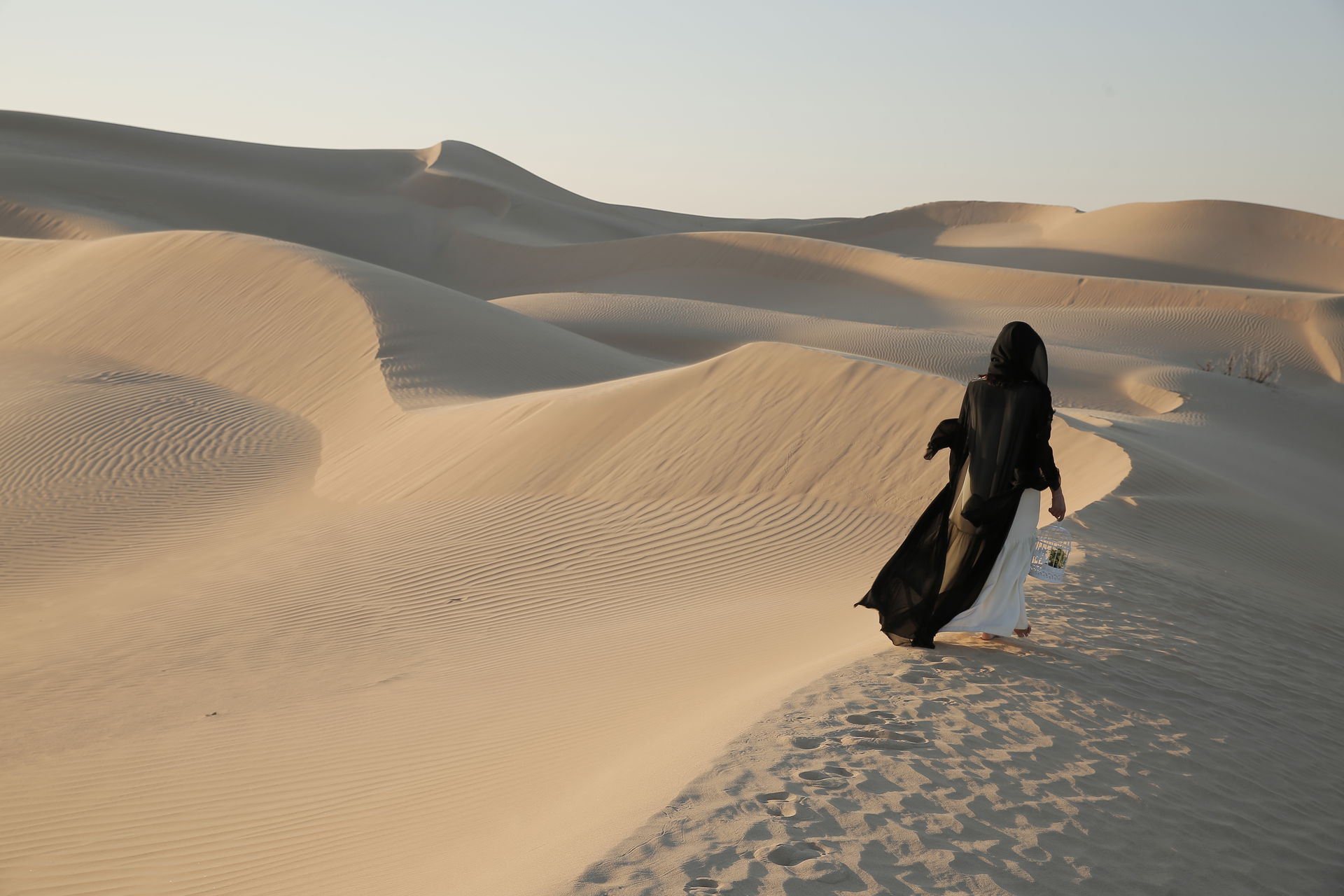 Here a lady is exploring the deserts of UAE heritage and tradit…