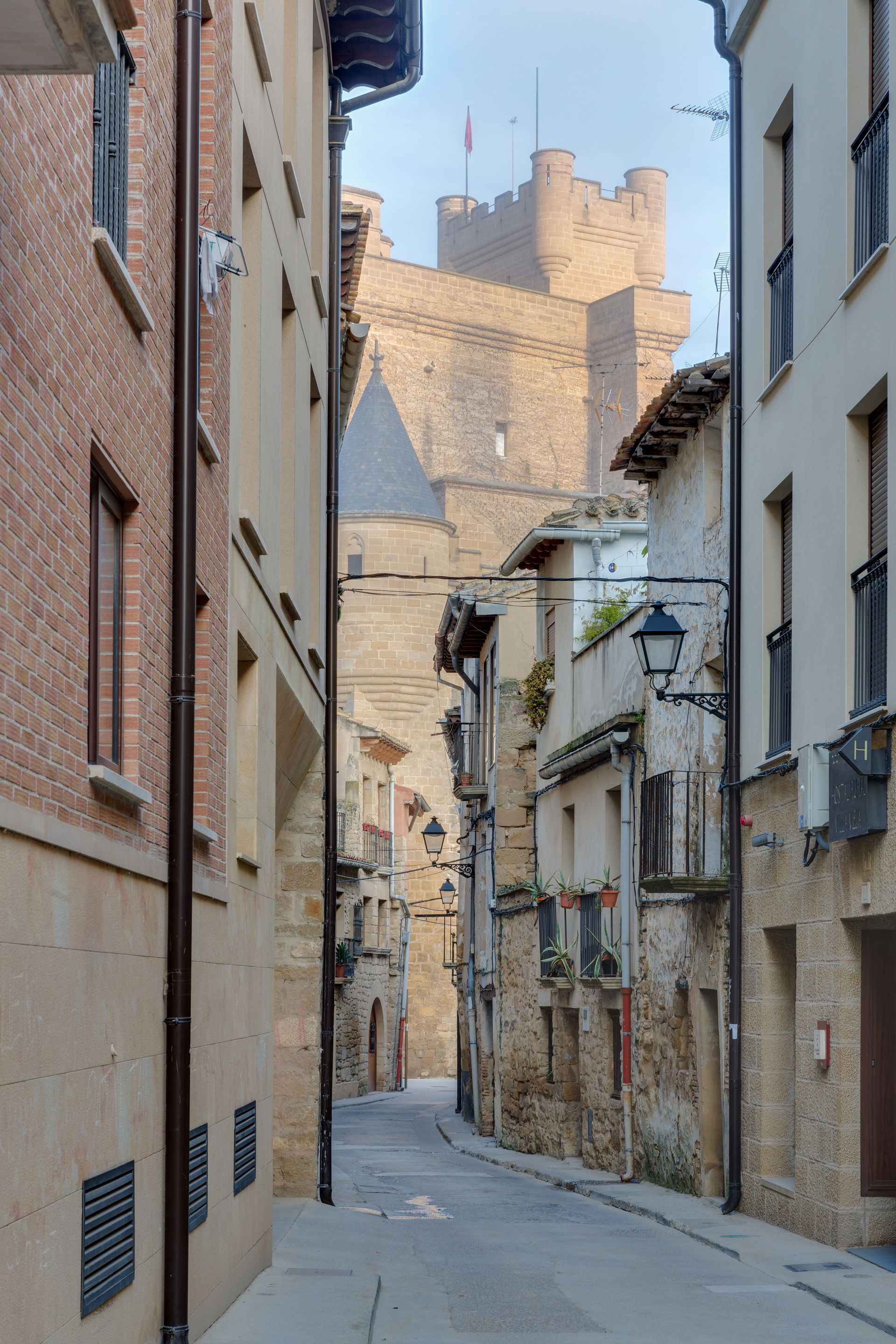 View of the narrow Rúa Villavieja with the Palace of the Kings …