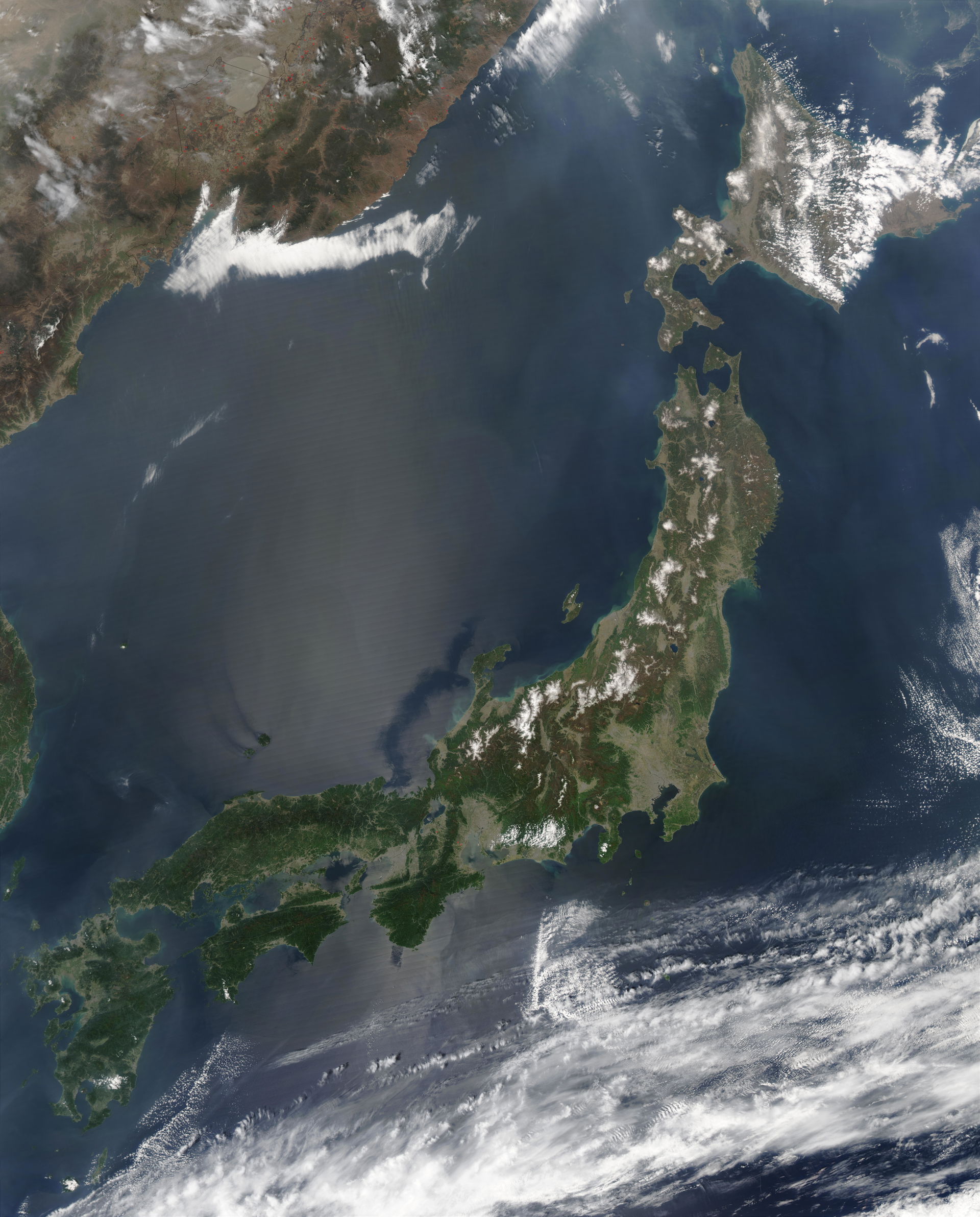 Satellite image of Japan in May 2003.
The islands of Japan are …