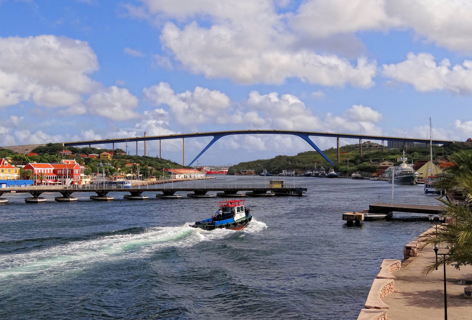 The Queen Emma pontoon bridge while semi-open, and Queen Julian…