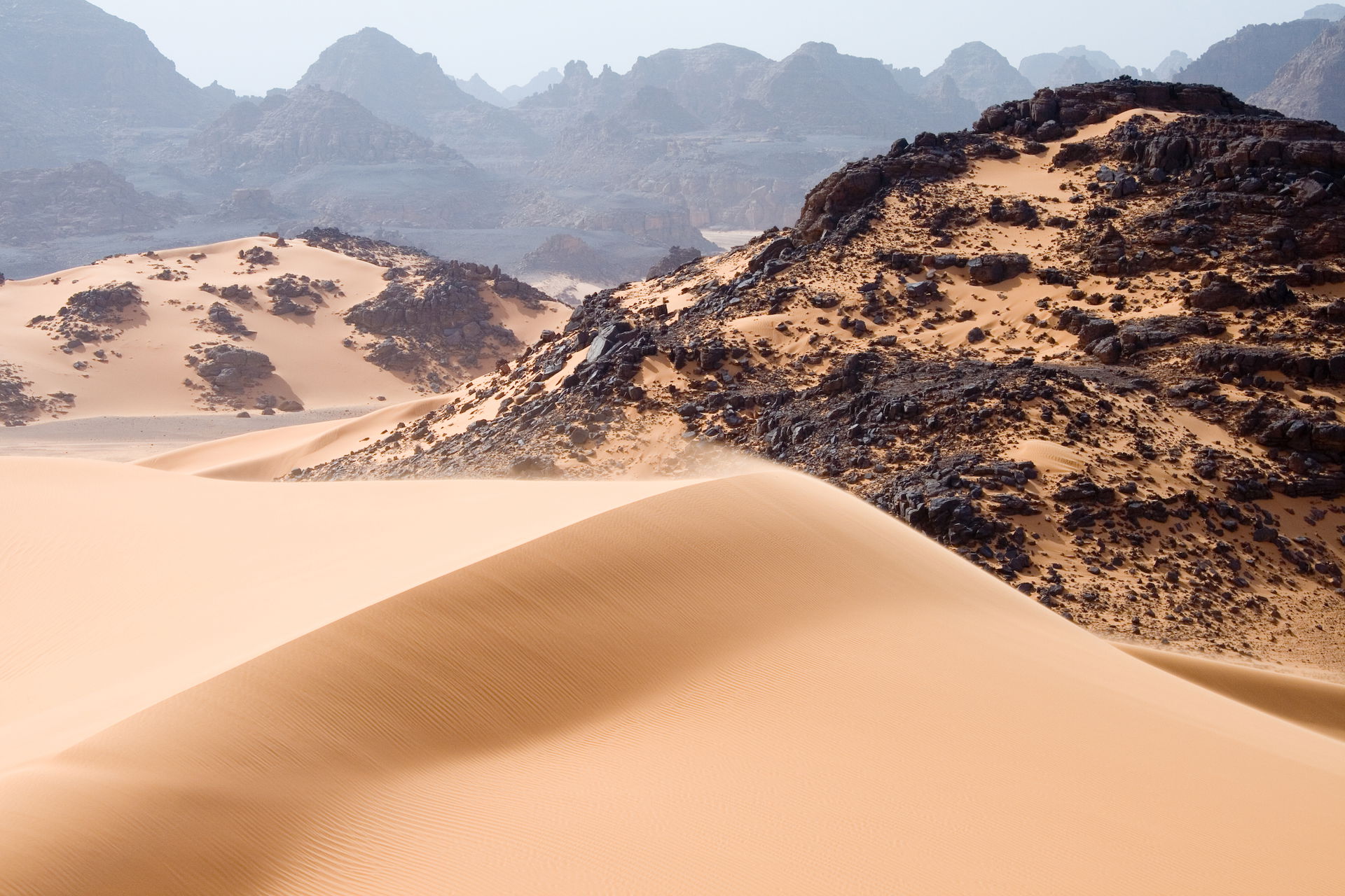 Moving sand dunes, rocks and mountains in Tadrart Acacus a dese…