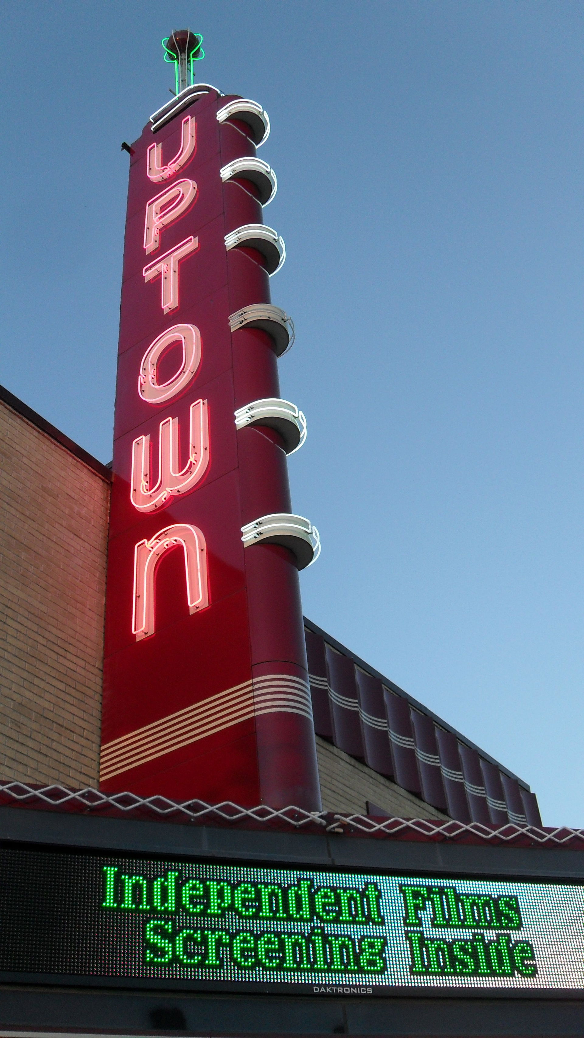The illuminated sign of the Uptown Theatre in Downtown Grand Pr…
