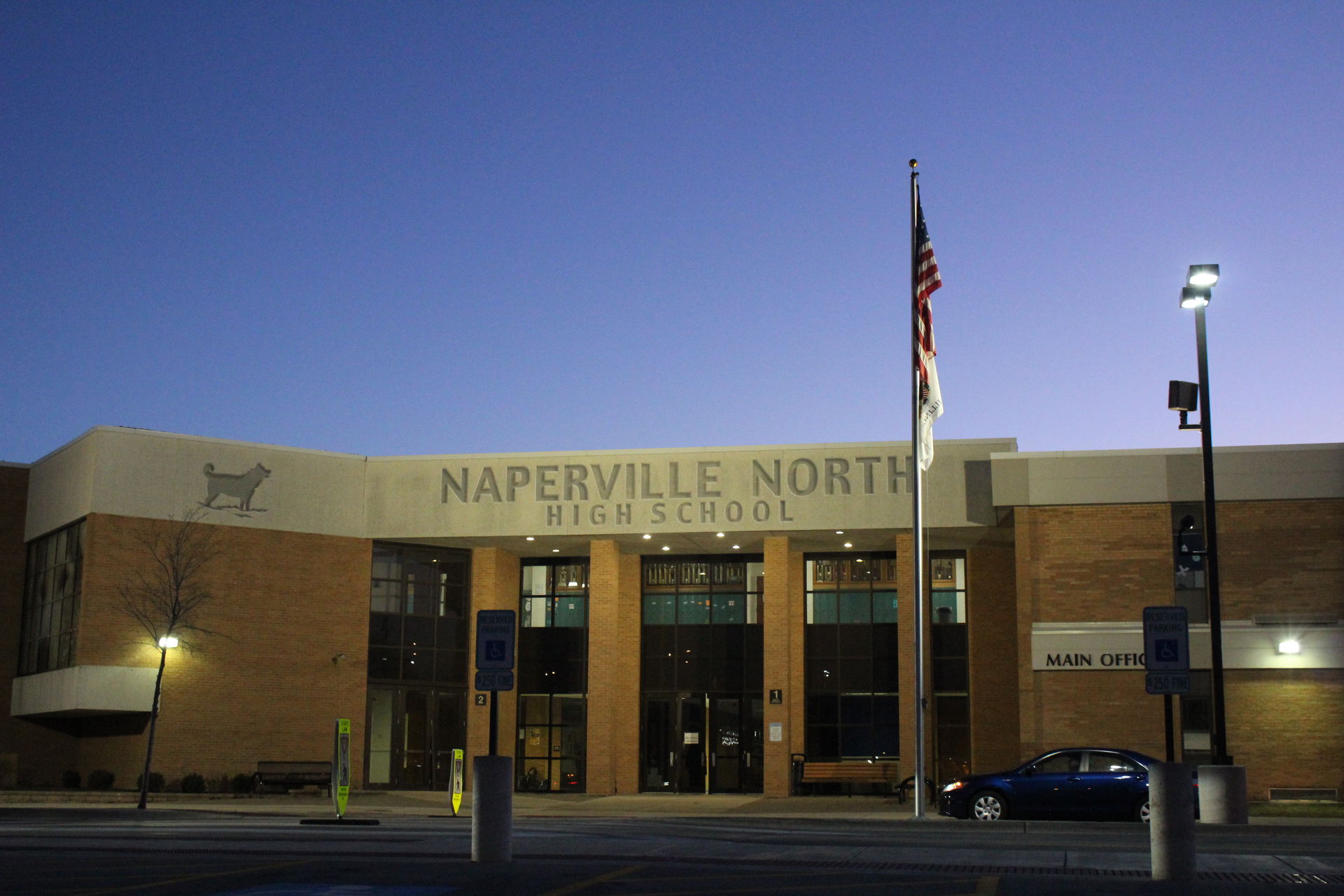 The main entrance of Naperville North, taken at dusk.  This was…