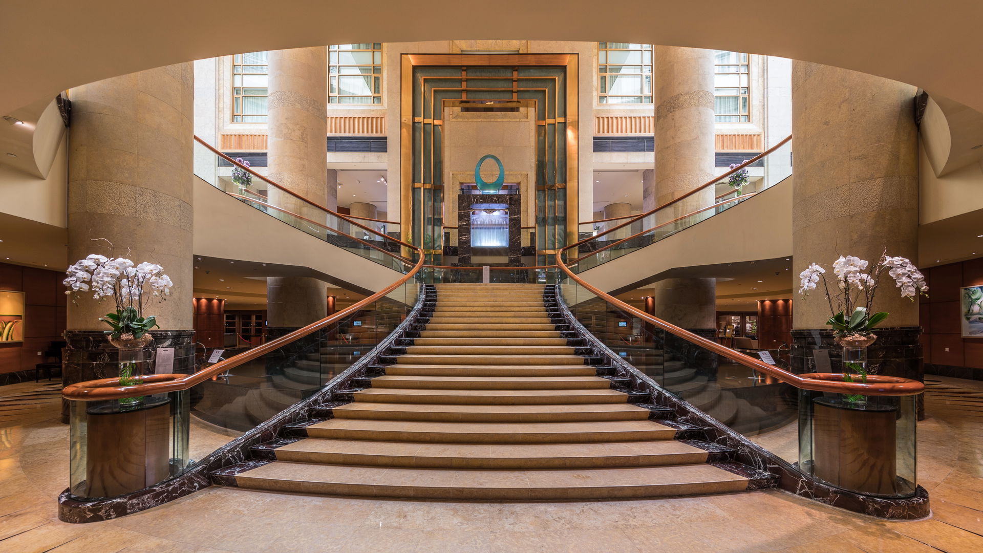 Symmetric view of the staircase at The Fullerton Hotel, Singapo…