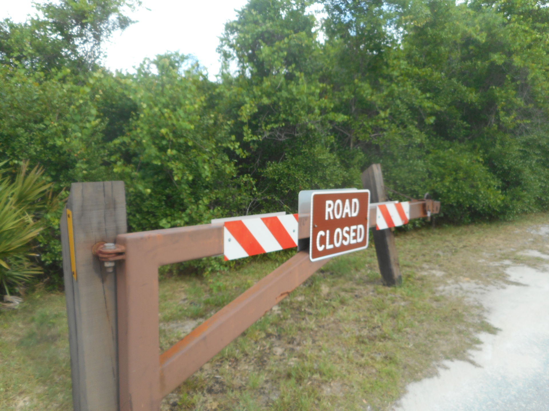 The left wooden gate to the entrance of the Juniper Springs Rec…