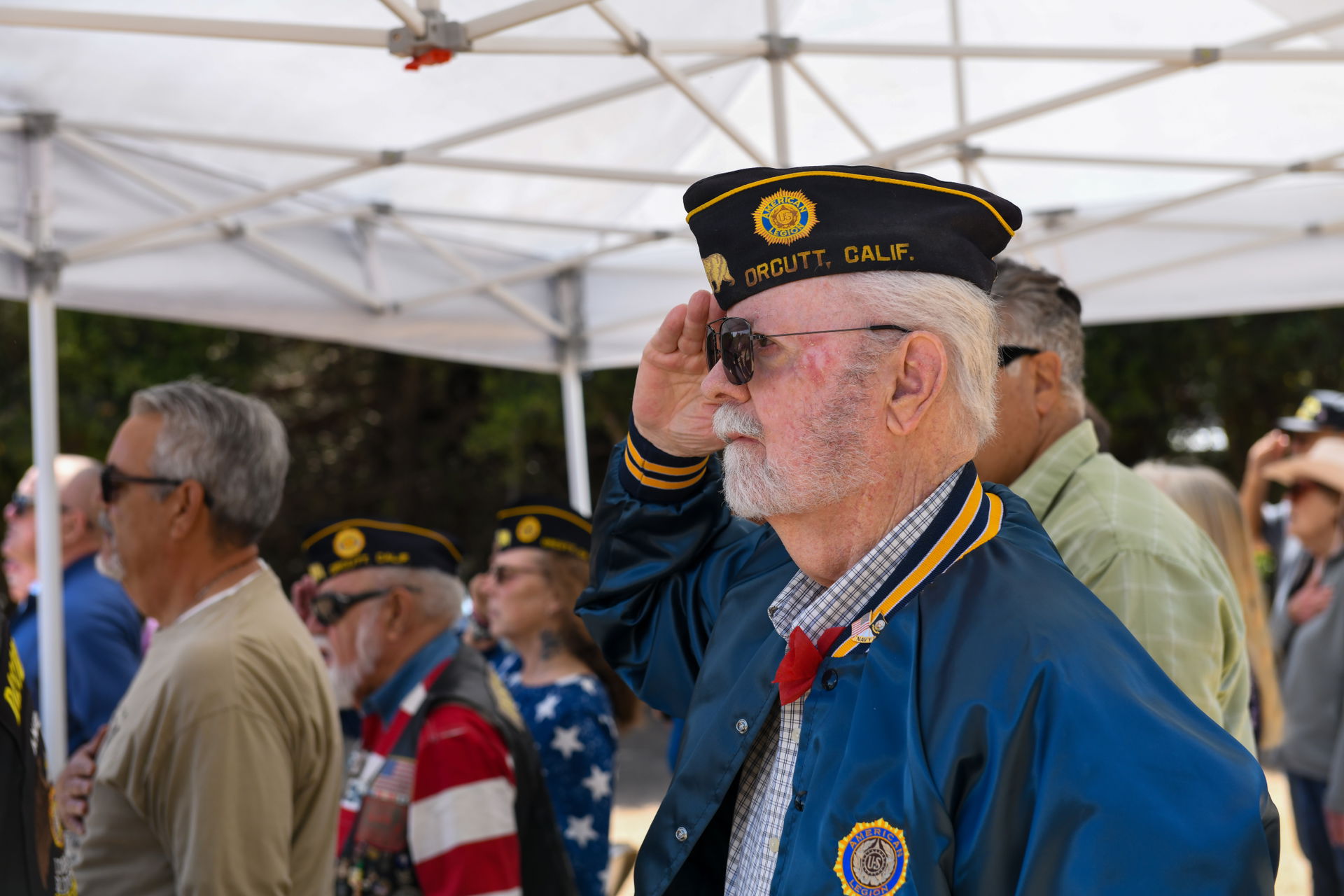 Attendees pay their respects during a Memorial Day ceremony in …